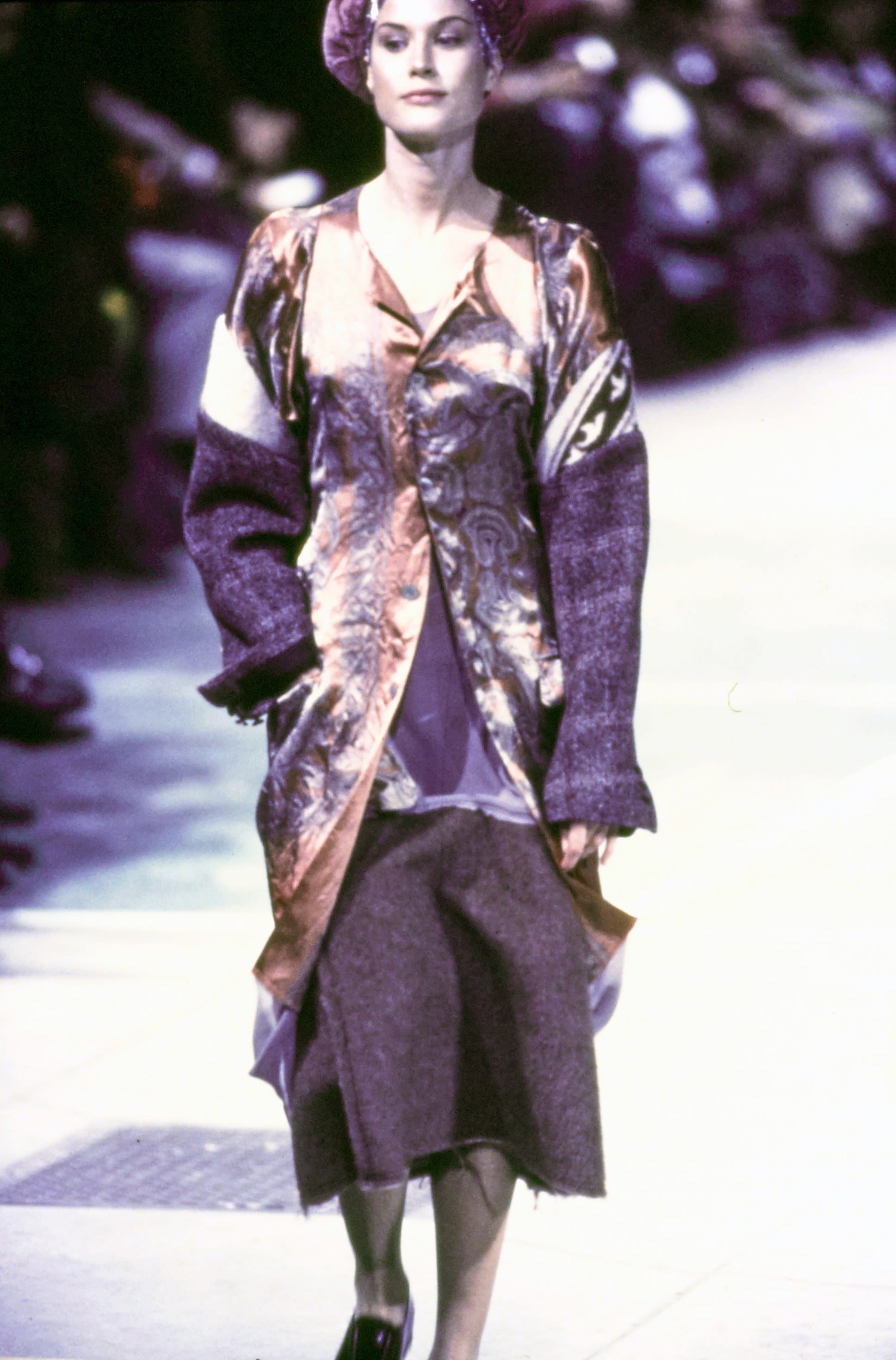 Comme des Garçons Fall 1993 Ready-to-Wear runway look 10: metallic patterned blazer over a dark asymmetric skirt.