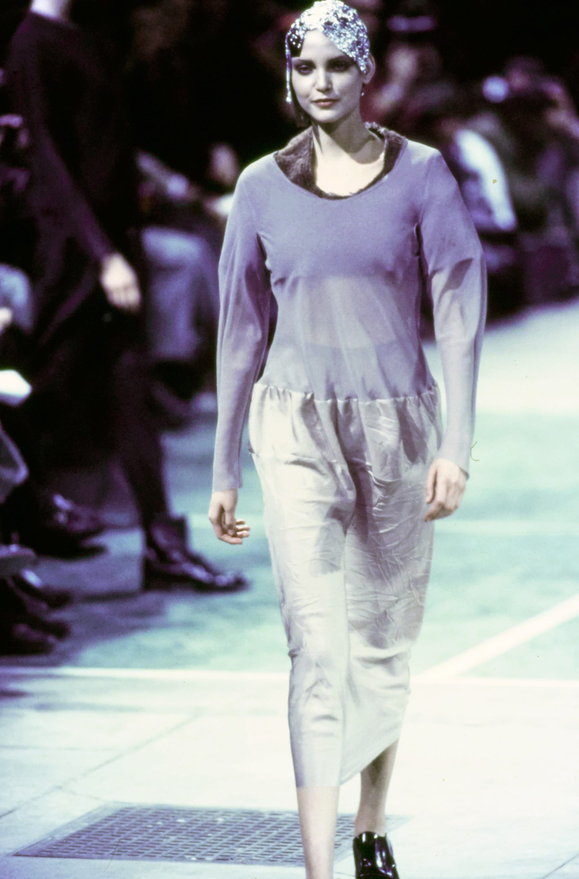 Comme des Garçons Fall 1993 Ready-to-Wear runway look 14: mauve top with a translucent grey skirt.