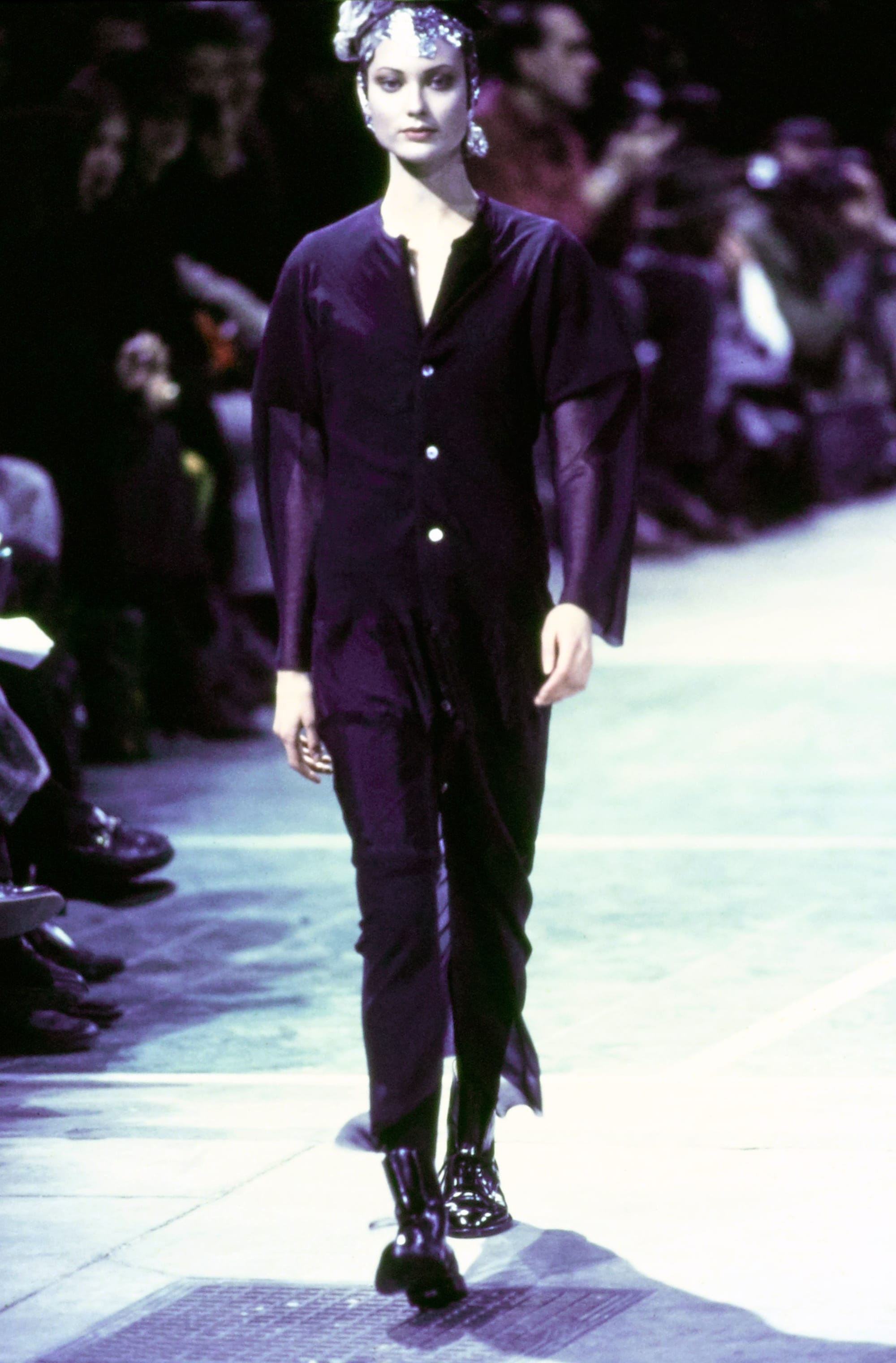 Comme des Garçons Fall 1993 Ready-to-Wear runway look 15: dark tailored jacket and slim trousers.