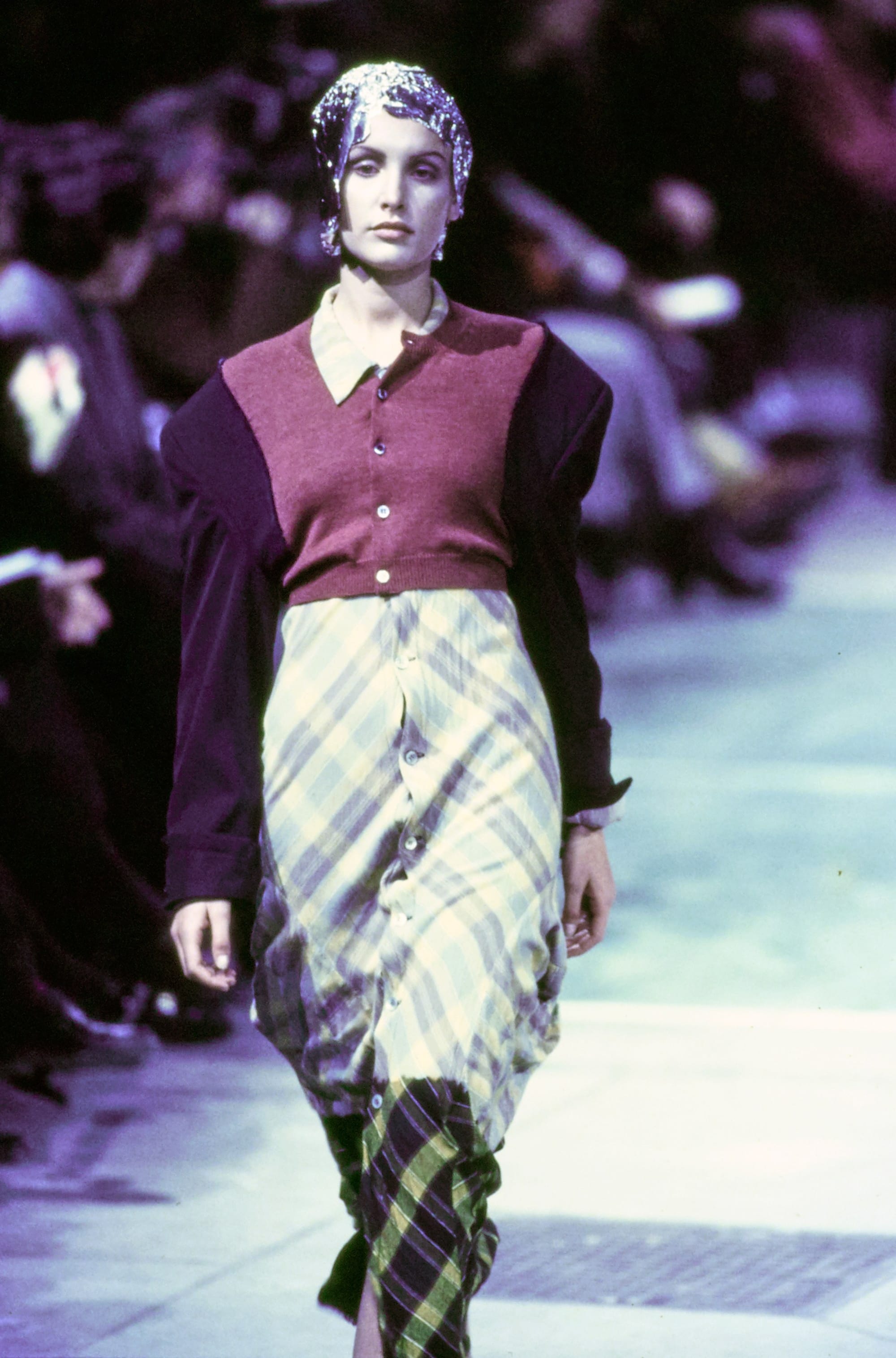 Comme des Garçons Fall 1993 Ready-to-Wear runway look 20: burgundy wrap top with a diagonally patterned skirt.