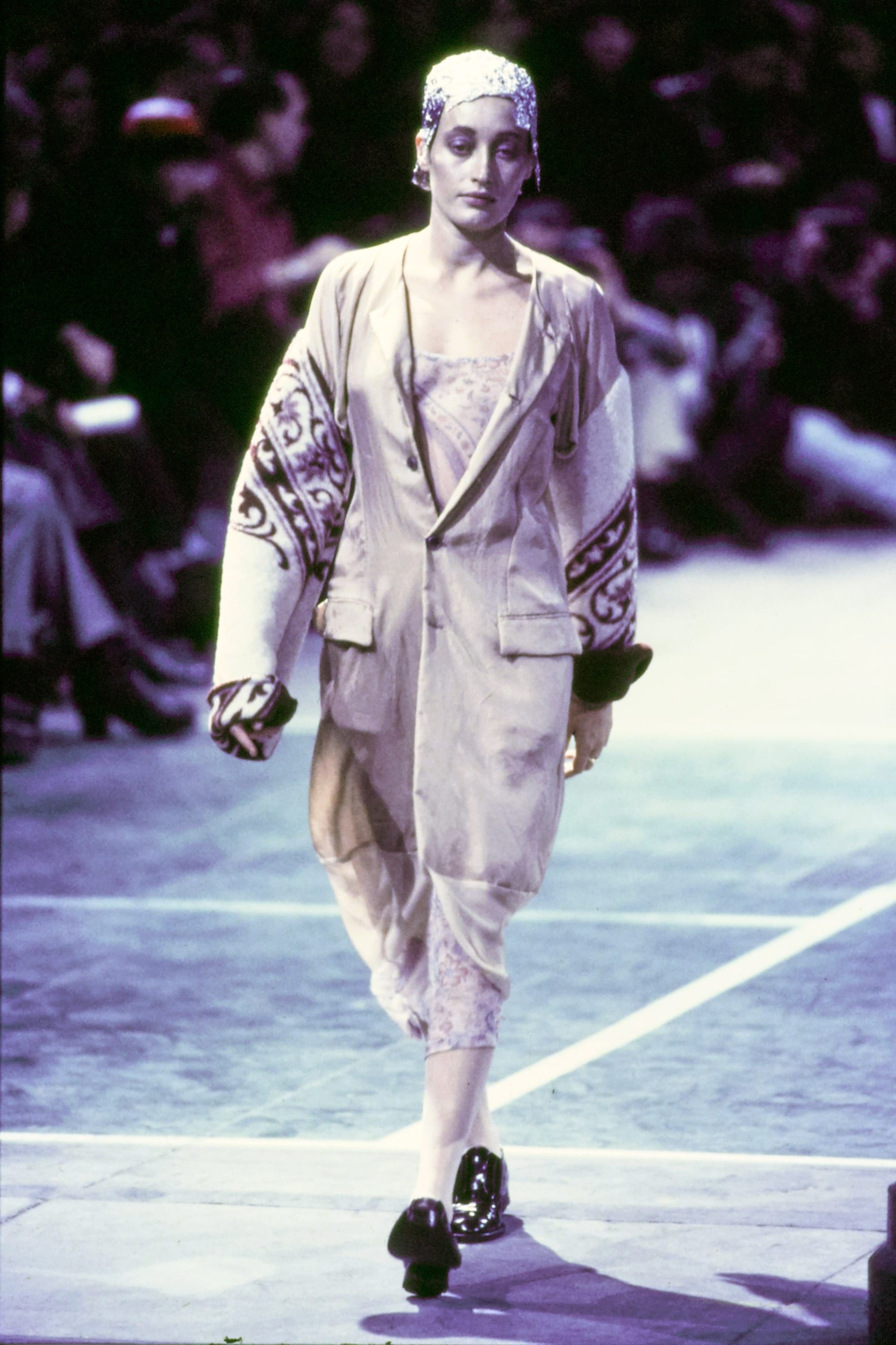 Comme des Garçons Fall 1993 Ready-to-Wear runway look 26: silver oversized jacket with pale trousers.