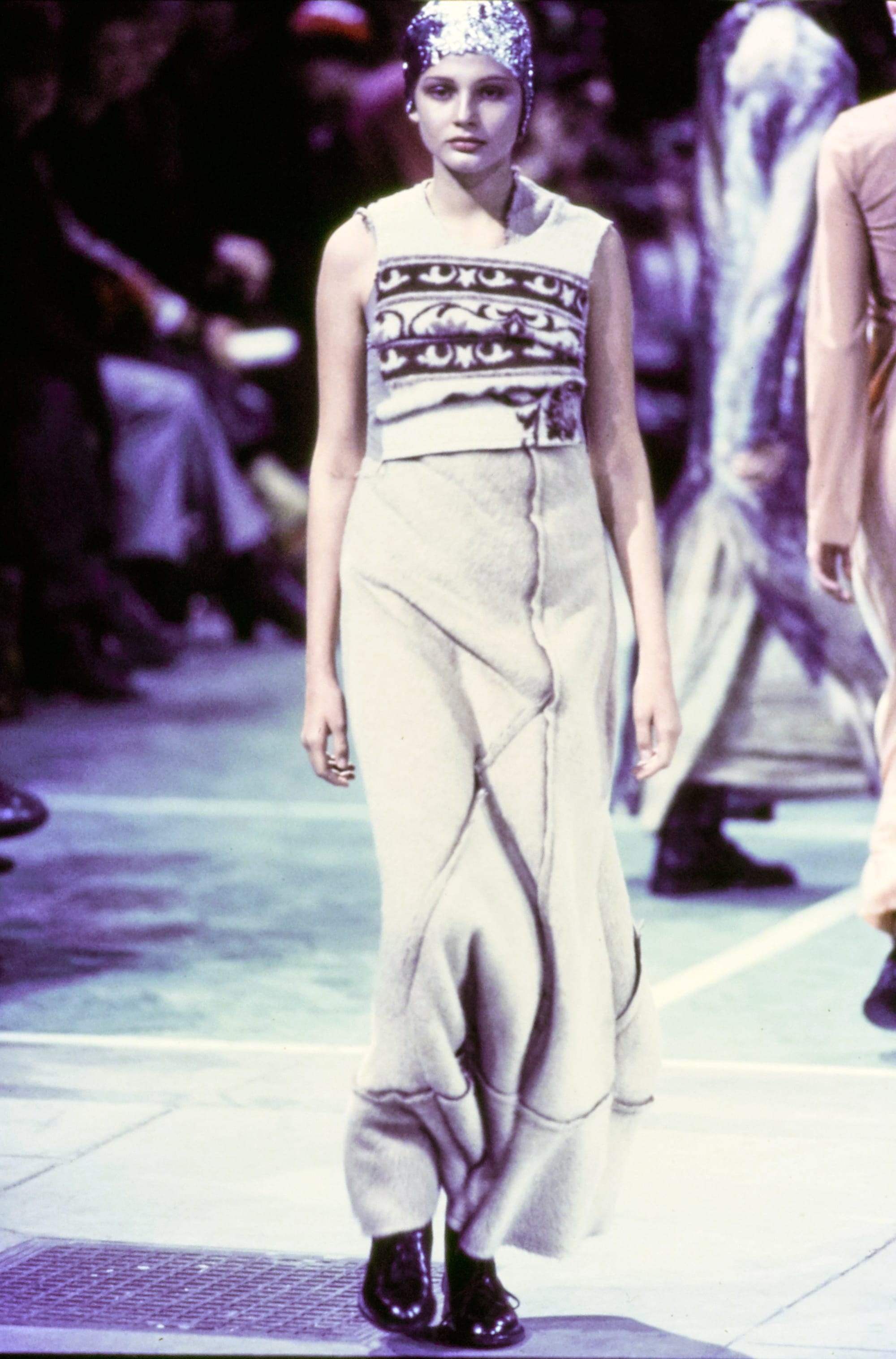 Comme des Garçons Fall 1993 Ready-to-Wear runway look 28: cream sleeveless jumpsuit with graphic chest bands.