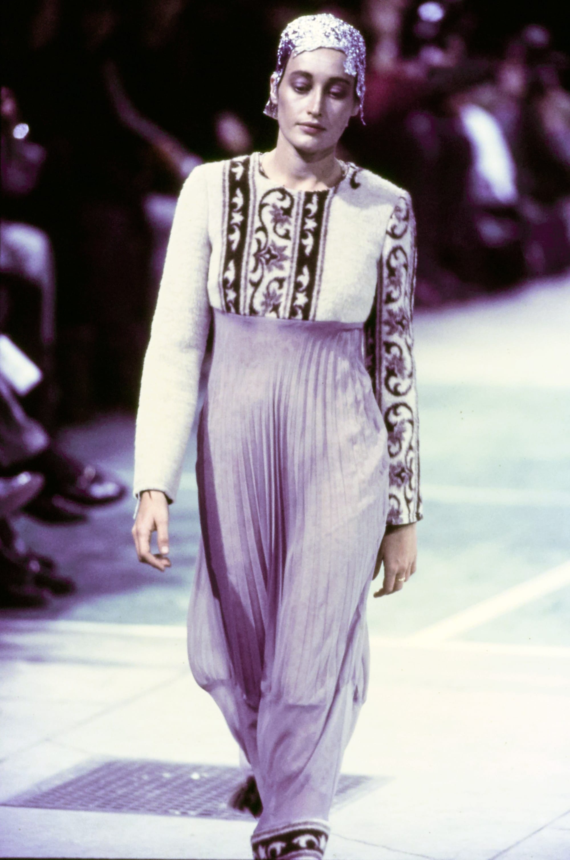 Comme des Garçons Fall 1993 Ready-to-Wear runway look 34: pale sleeveless top with graphic panel and wide trousers.