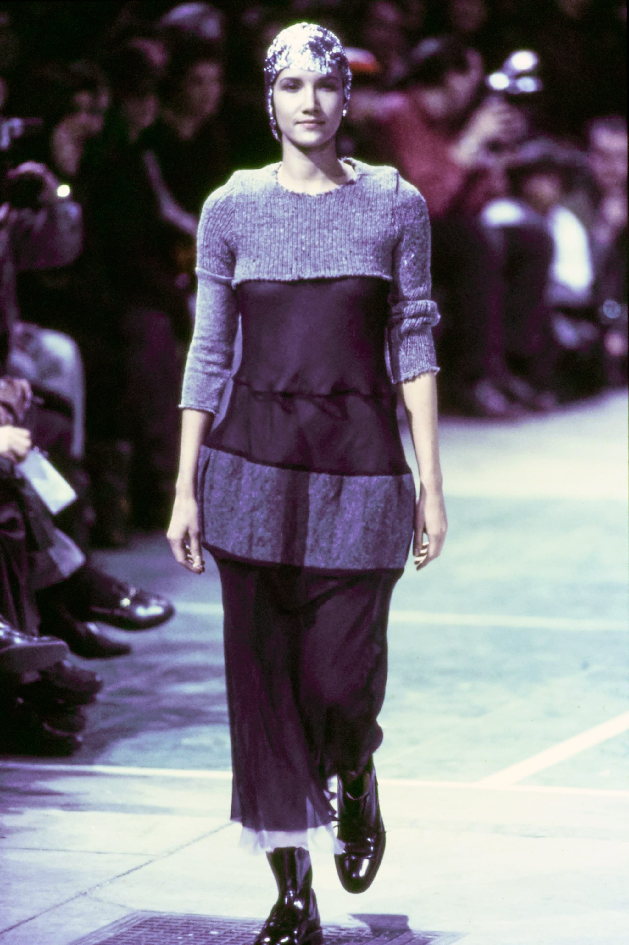 Comme des Garçons Fall 1993 Ready-to-Wear runway look 42: purple short-sleeve tunic over dark trousers.