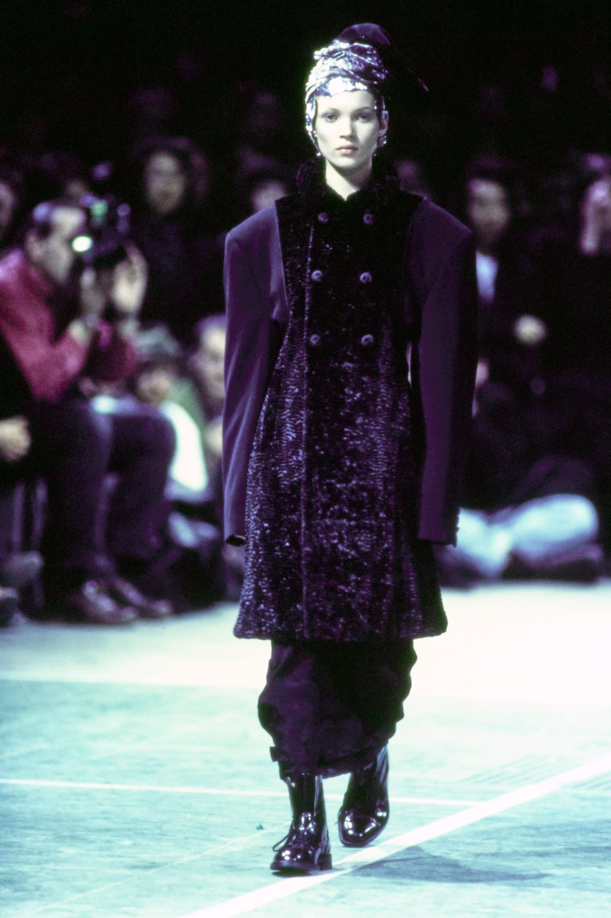 Comme des Garçons Fall 1993 Ready-to-Wear runway look 43: black embellished coat over dark trousers.