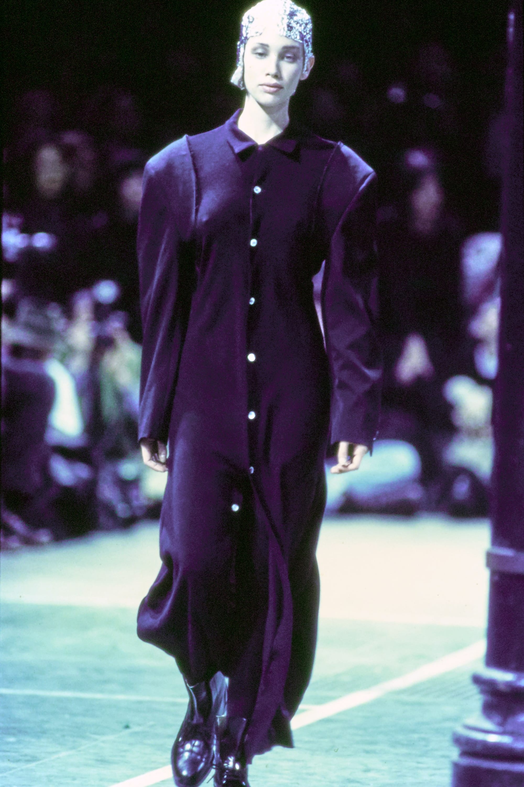 Comme des Garçons Fall 1993 Ready-to-Wear runway look 44: long dark plum coat and skirt.