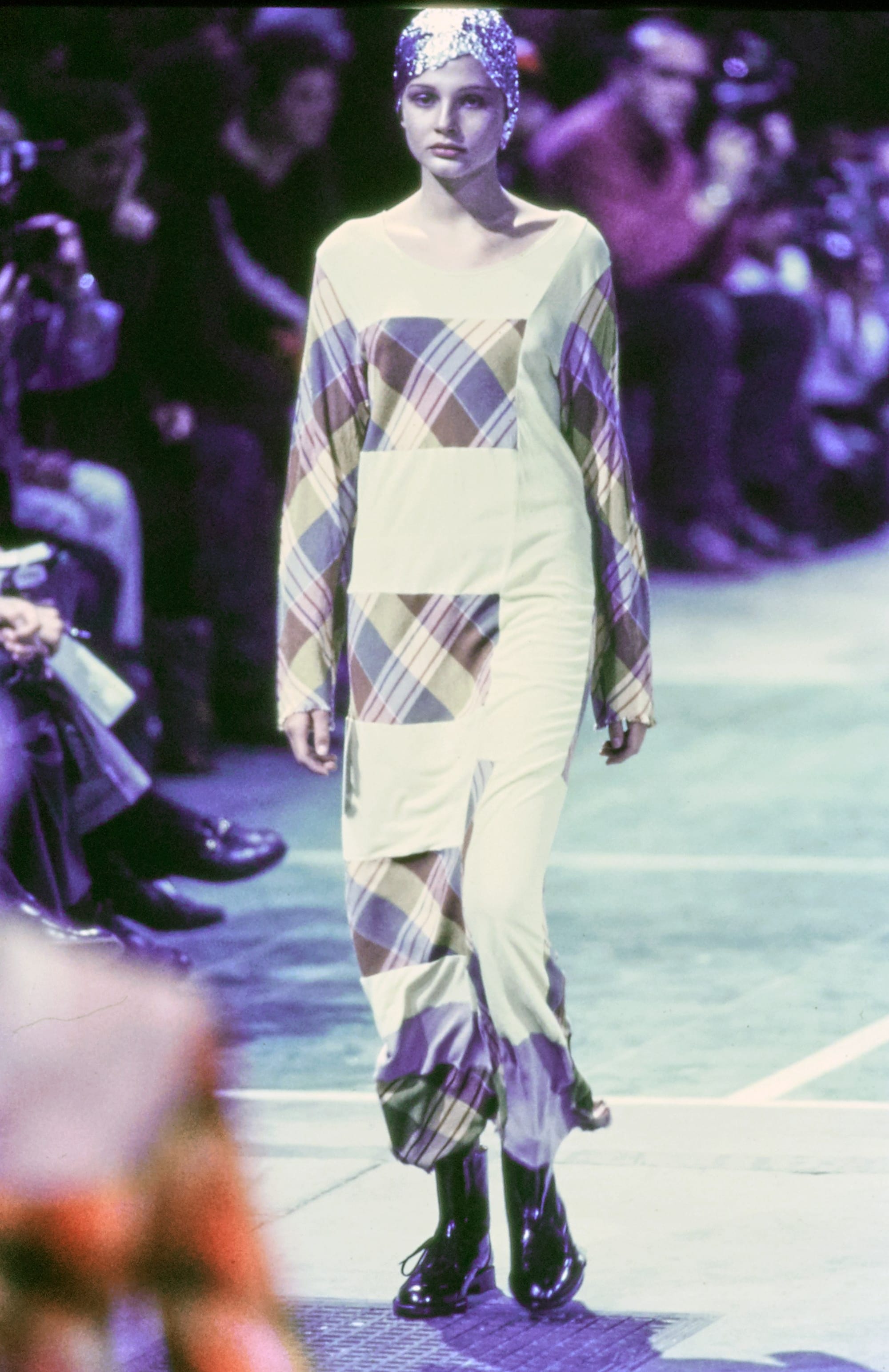 Comme des Garçons Fall 1993 Ready-to-Wear runway look 50: pale geometric-print dress with black boots.