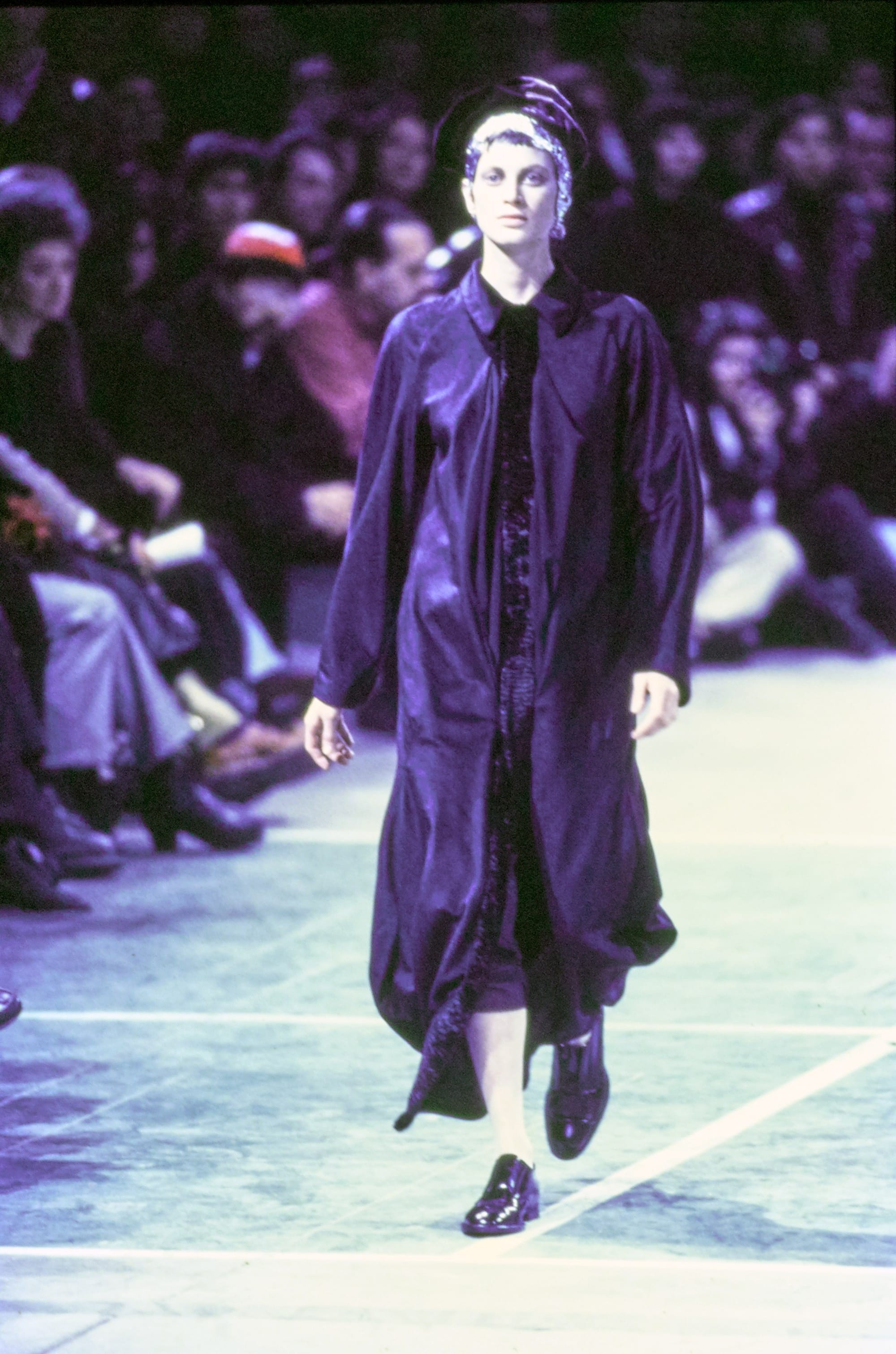 Comme des Garçons Fall 1993 Ready-to-Wear runway look 54: dark layered jacket with cropped trousers.