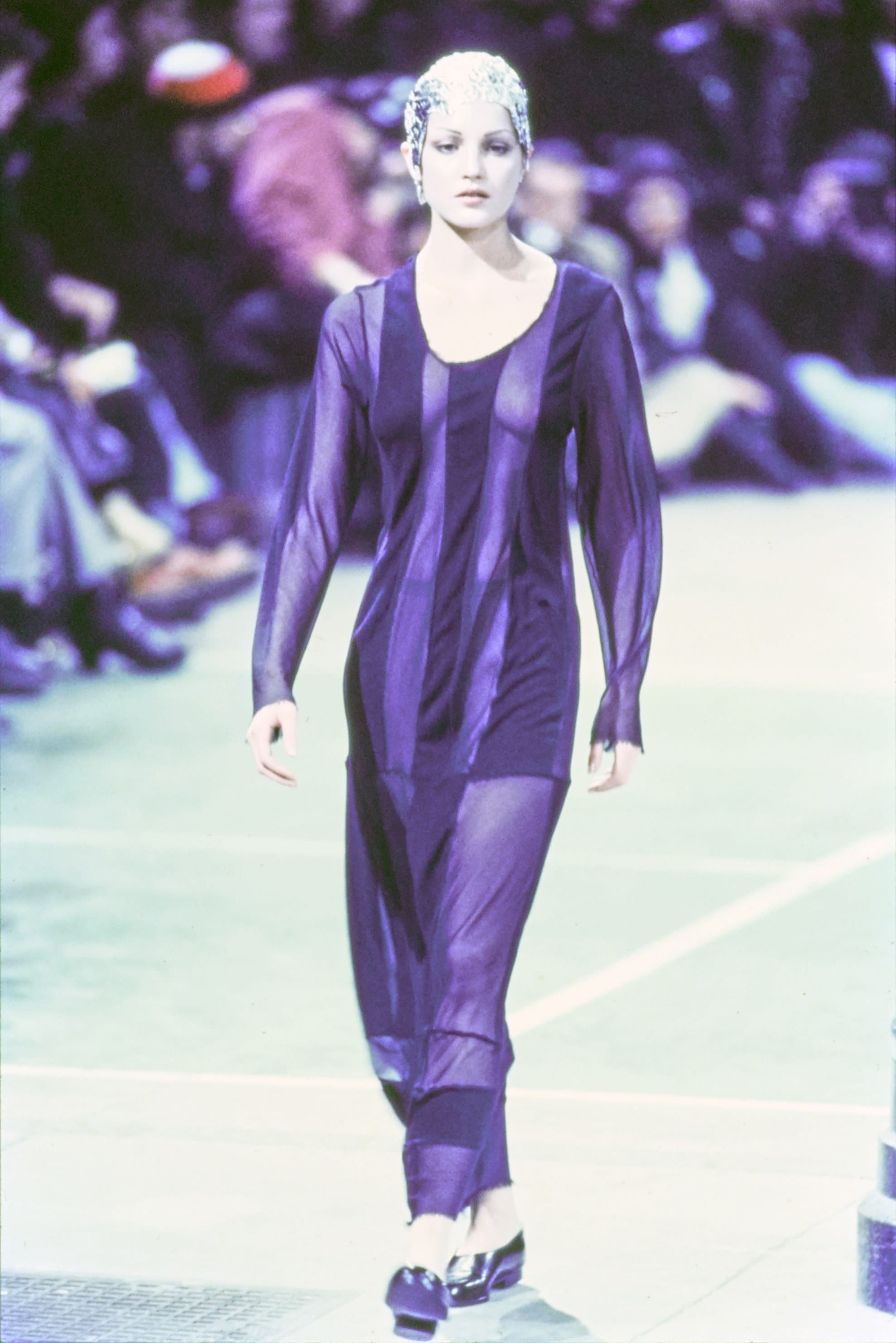 Comme des Garçons Fall 1993 Ready-to-Wear runway look 62: dark sleeveless dress with sheer side panels.