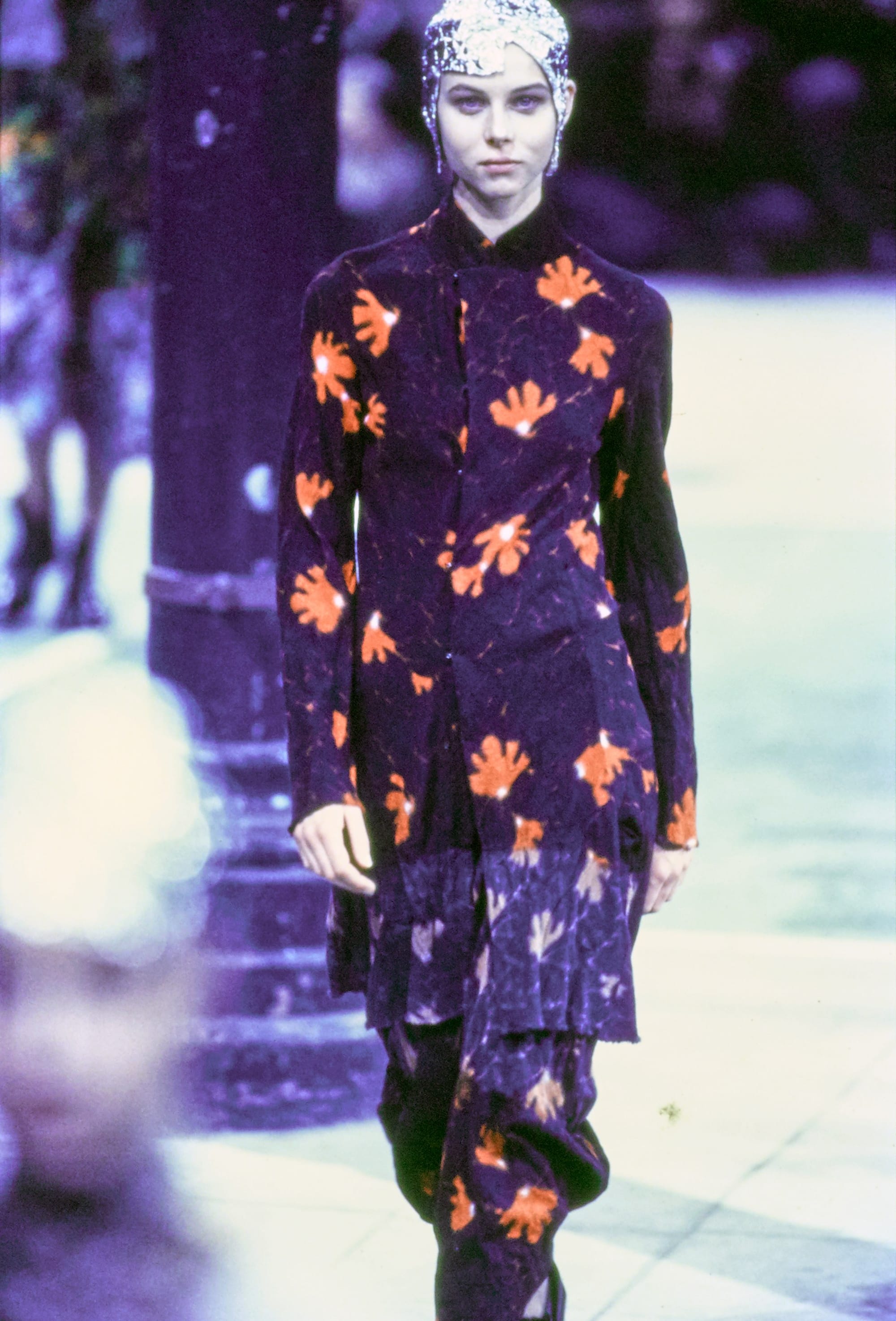 Comme des Garçons Fall 1993 Ready-to-Wear runway look 69: dark purple suit with orange floral motifs.