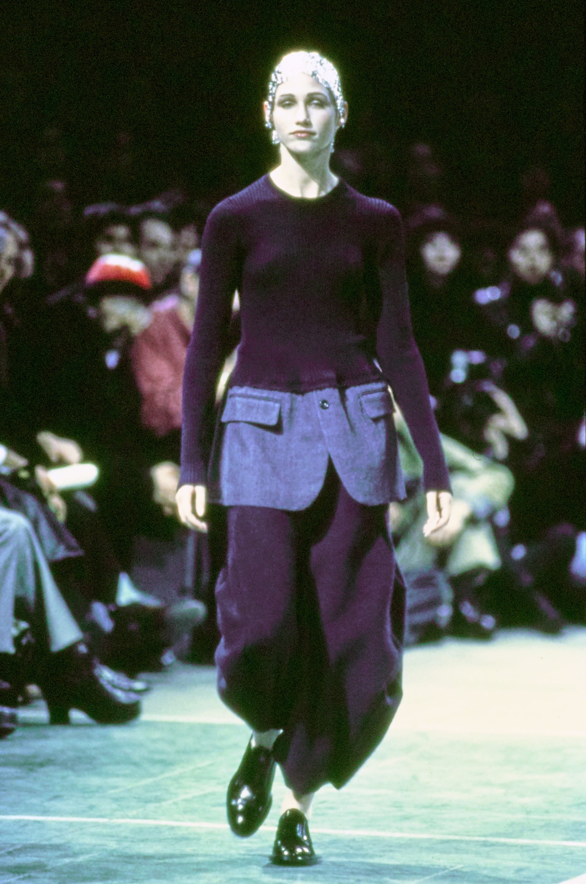 Comme des Garçons Fall 1993 Ready-to-Wear runway look 7: black top with blue hip panels and dark trousers.