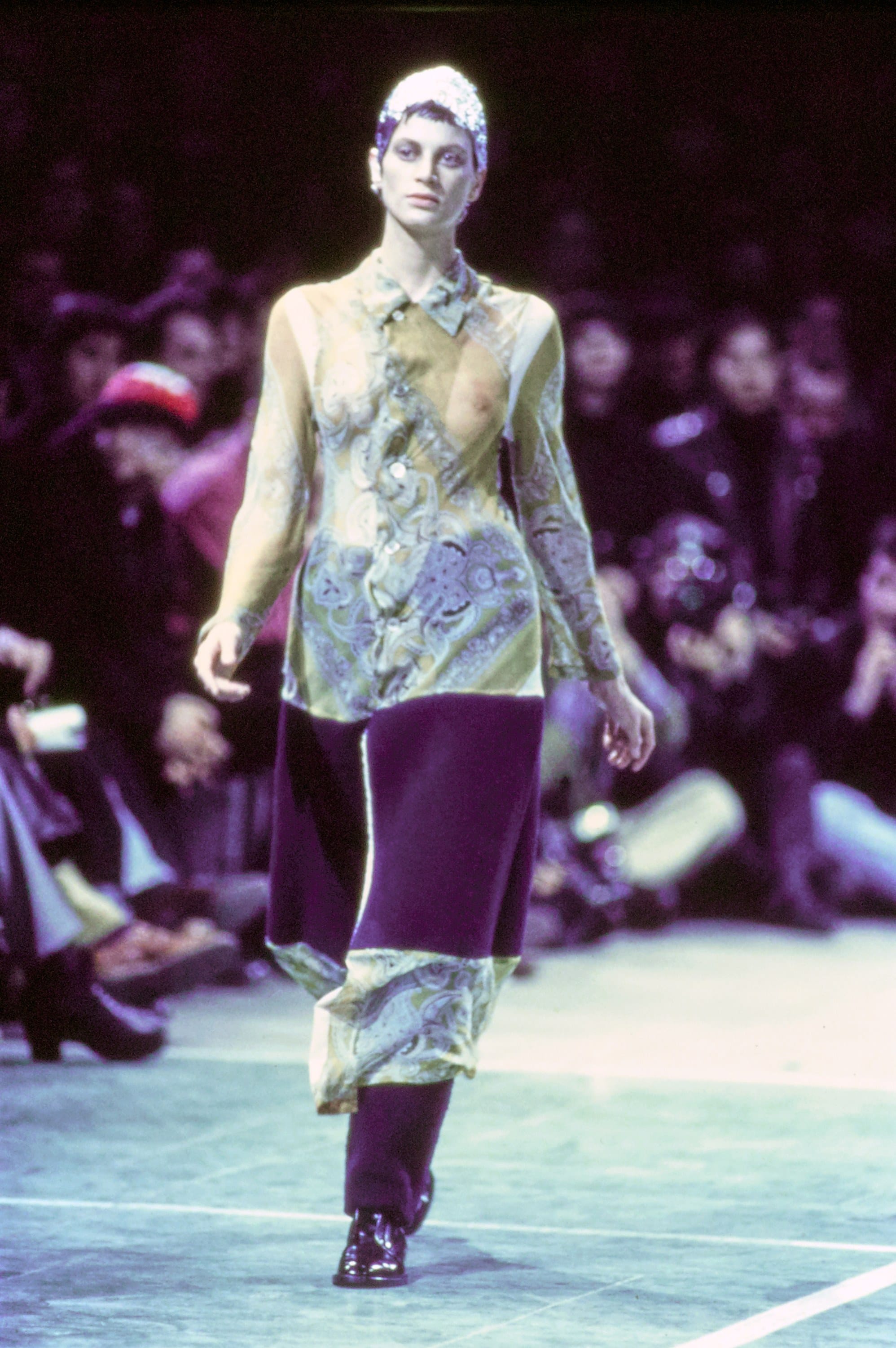 Comme des Garçons Fall 1993 Ready-to-Wear runway look 72: pale green asymmetric top with purple trousers.