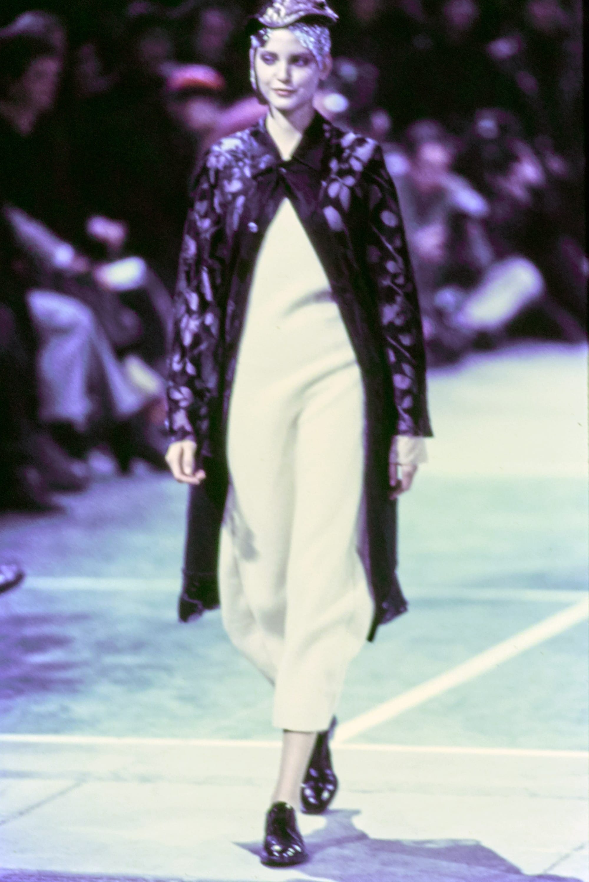 Comme des Garçons Fall 1993 Ready-to-Wear runway look 73: black patterned jacket over a pale asymmetric dress.