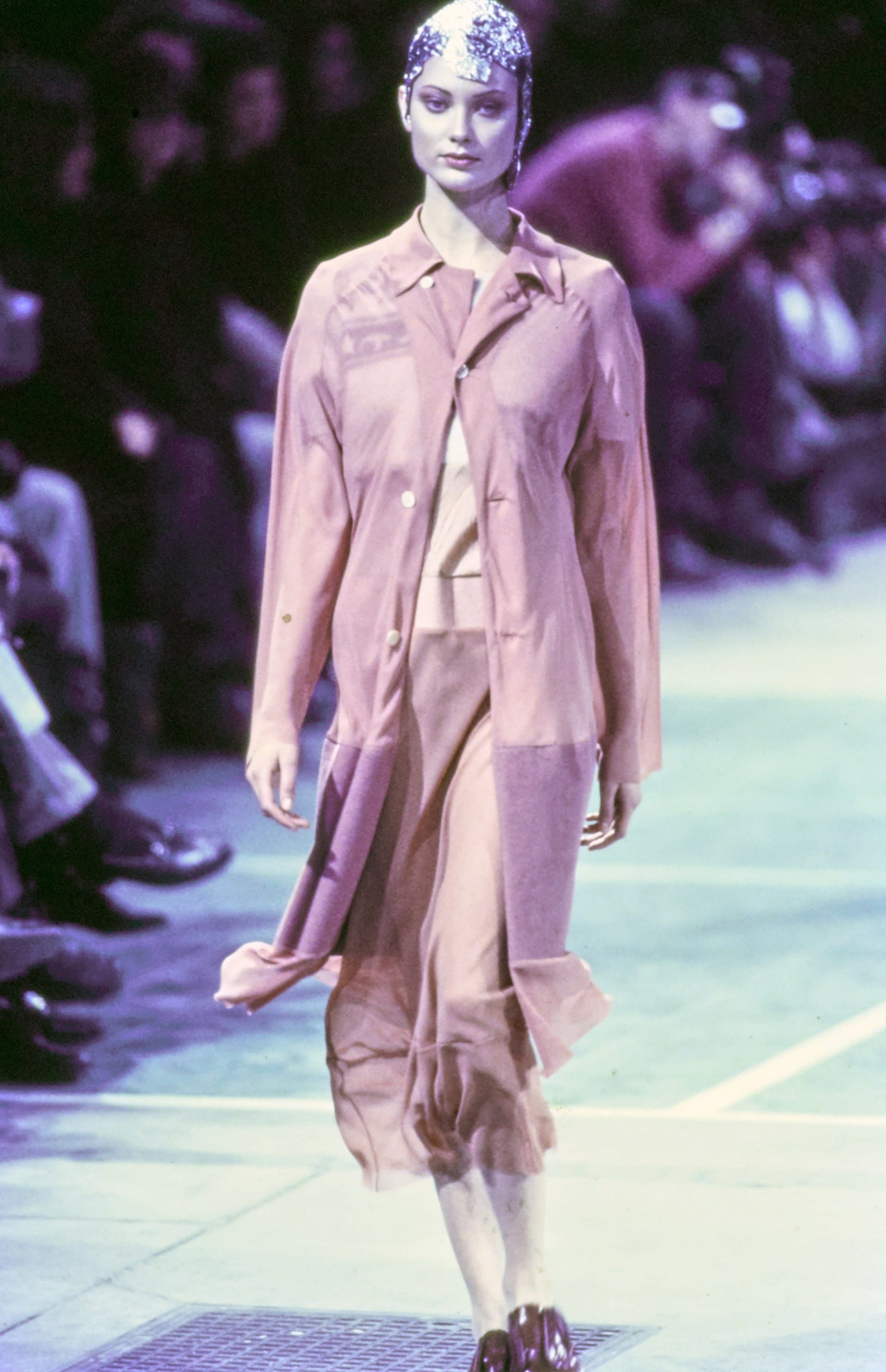 Comme des Garçons Fall 1993 Ready-to-Wear runway look 74: pale pink jacket and flowing skirt with striped socks.