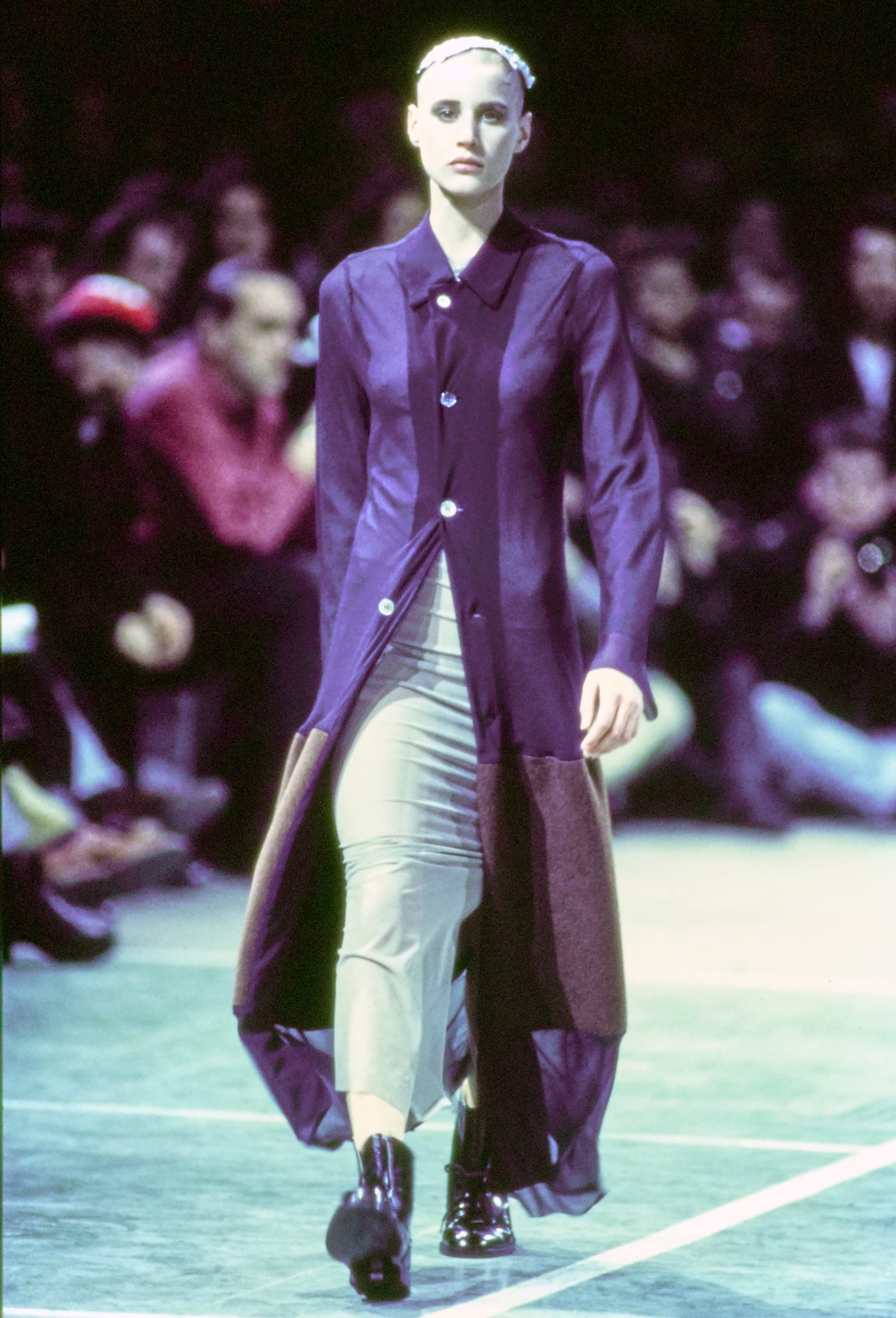 Comme des Garçons Fall 1993 Ready-to-Wear runway look 75: dark draped coat over black trousers.