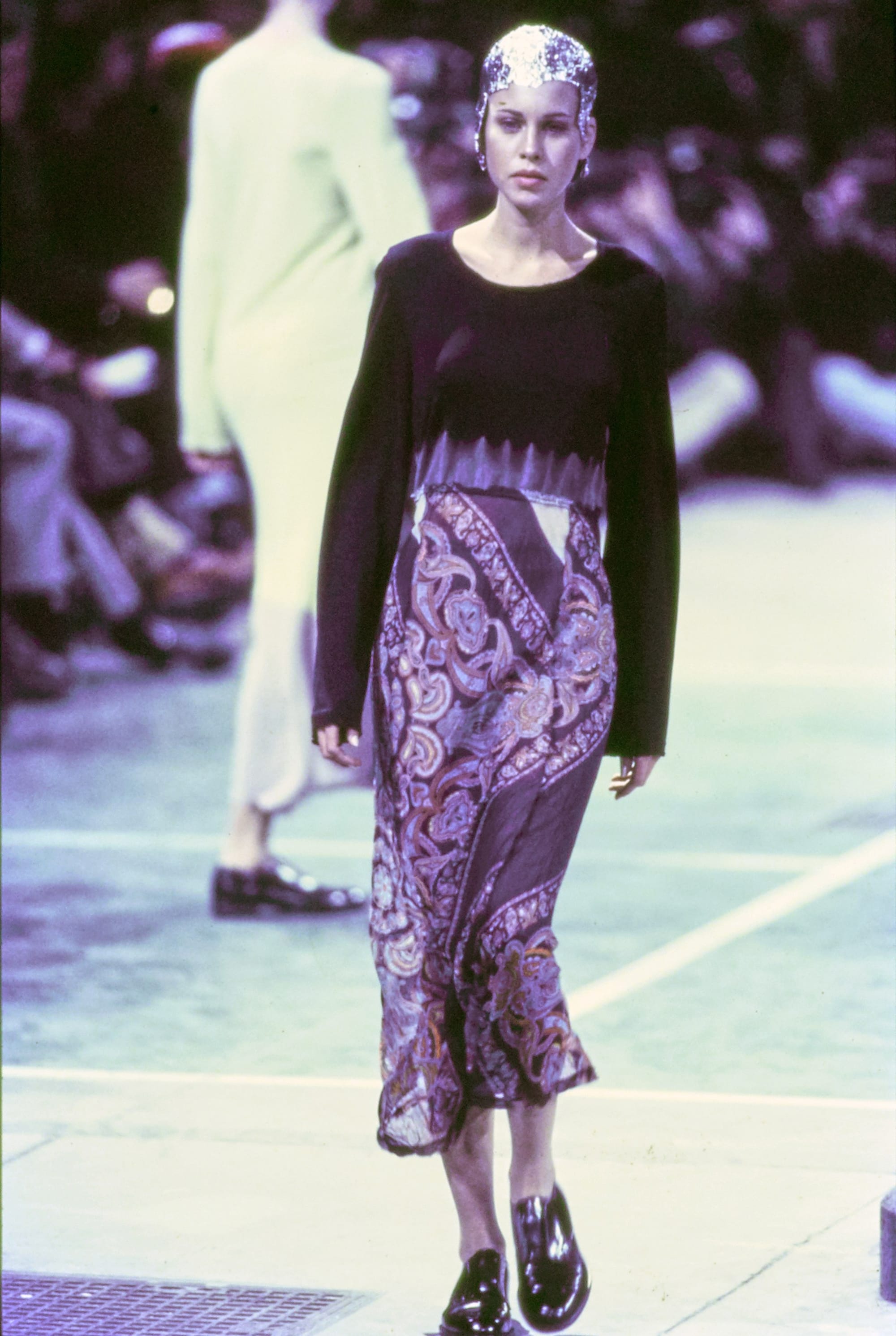 Comme des Garçons Fall 1993 Ready-to-Wear runway look 78: black tank with purple patterned skirt.