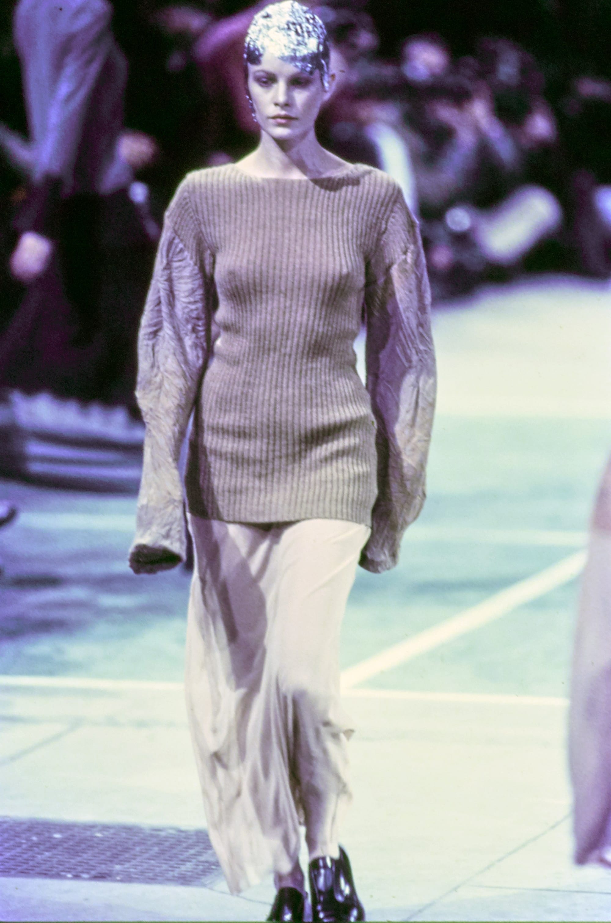 Comme des Garçons Fall 1993 Ready-to-Wear runway look 81: brown long-sleeve top with a sheer pale skirt.