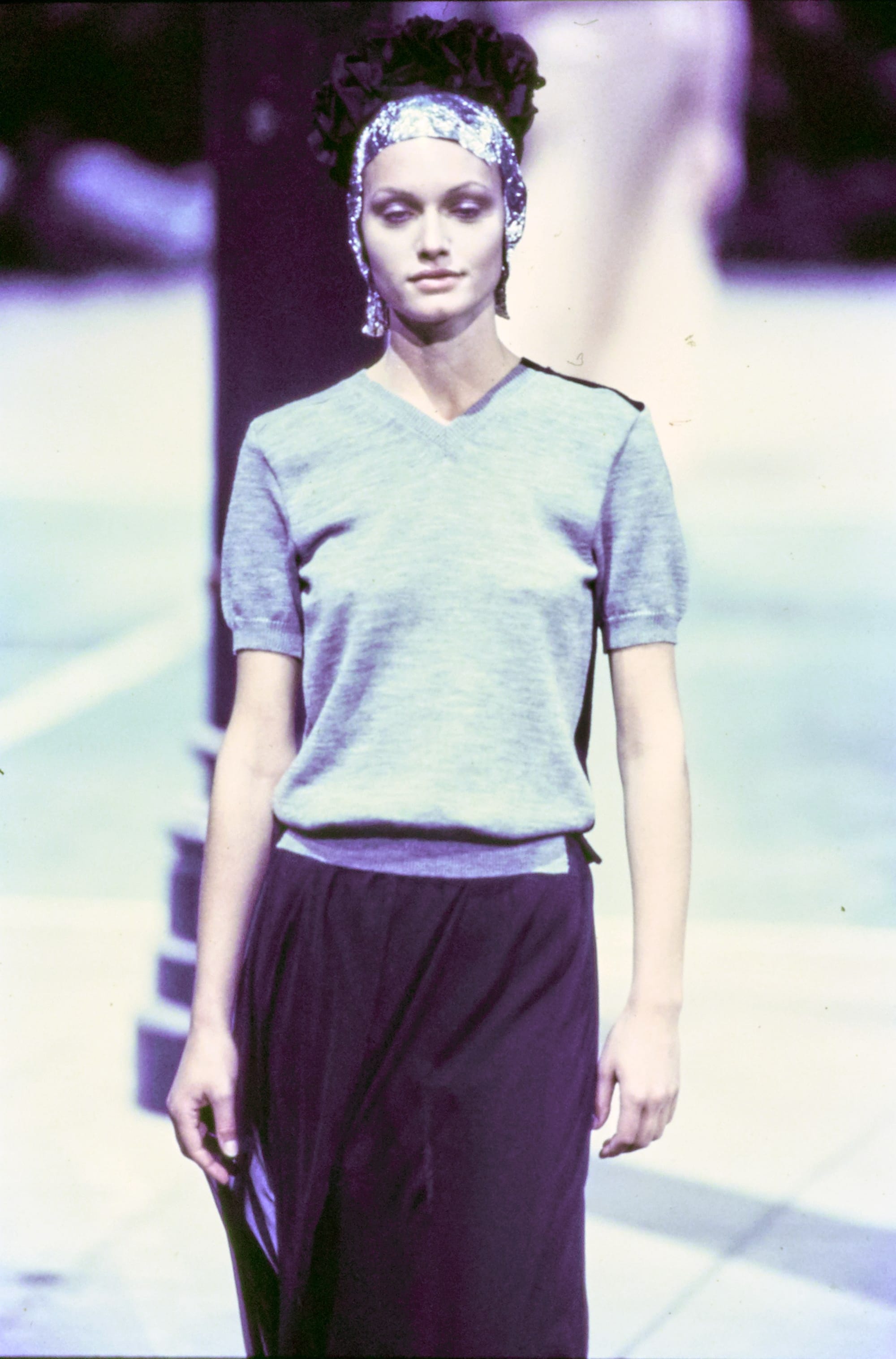 Comme des Garçons Fall 1993 Ready-to-Wear runway look 83: pale blue short-sleeve top with a dark asymmetric skirt.