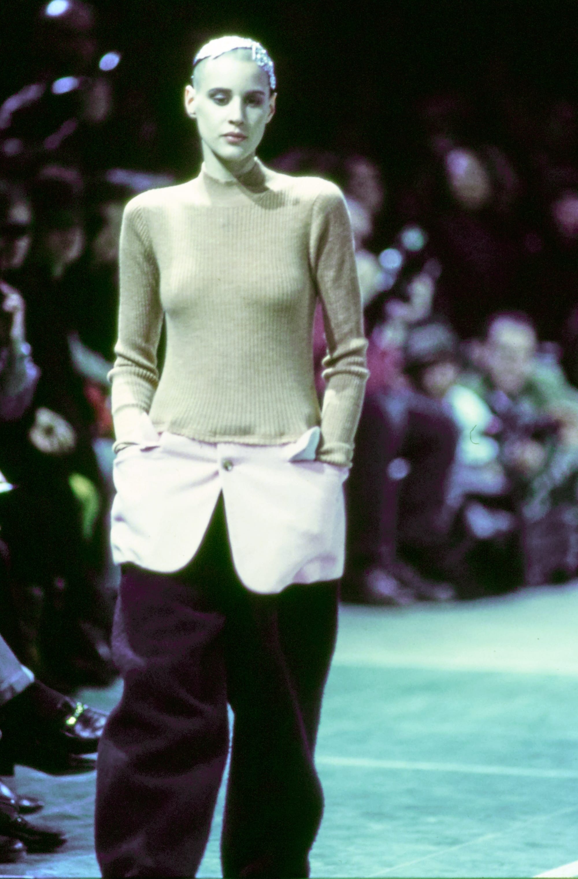 Comme des Garçons Fall 1993 Ready-to-Wear runway look 9: pale green fitted jacket with black trousers.
