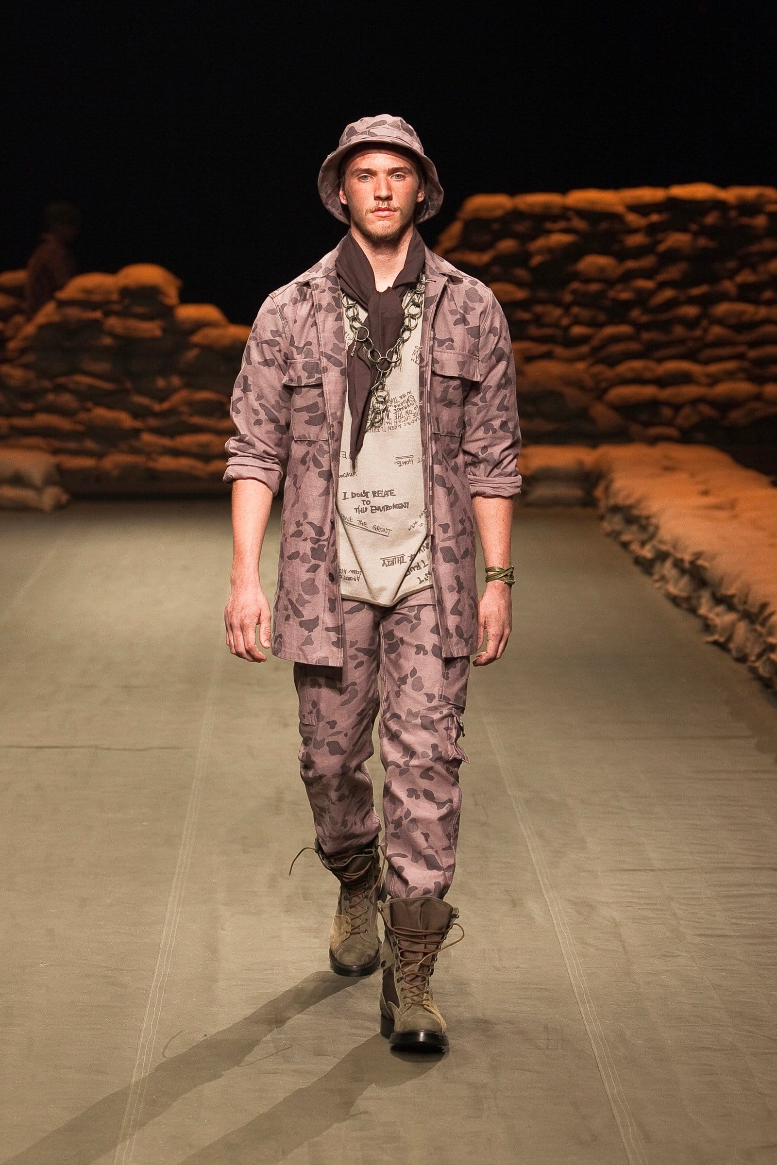 N.Hoolywood Autumn/Winter 2010–11 runway look 32: dusty pink camouflage jacket and trousers over a printed white T-shirt.