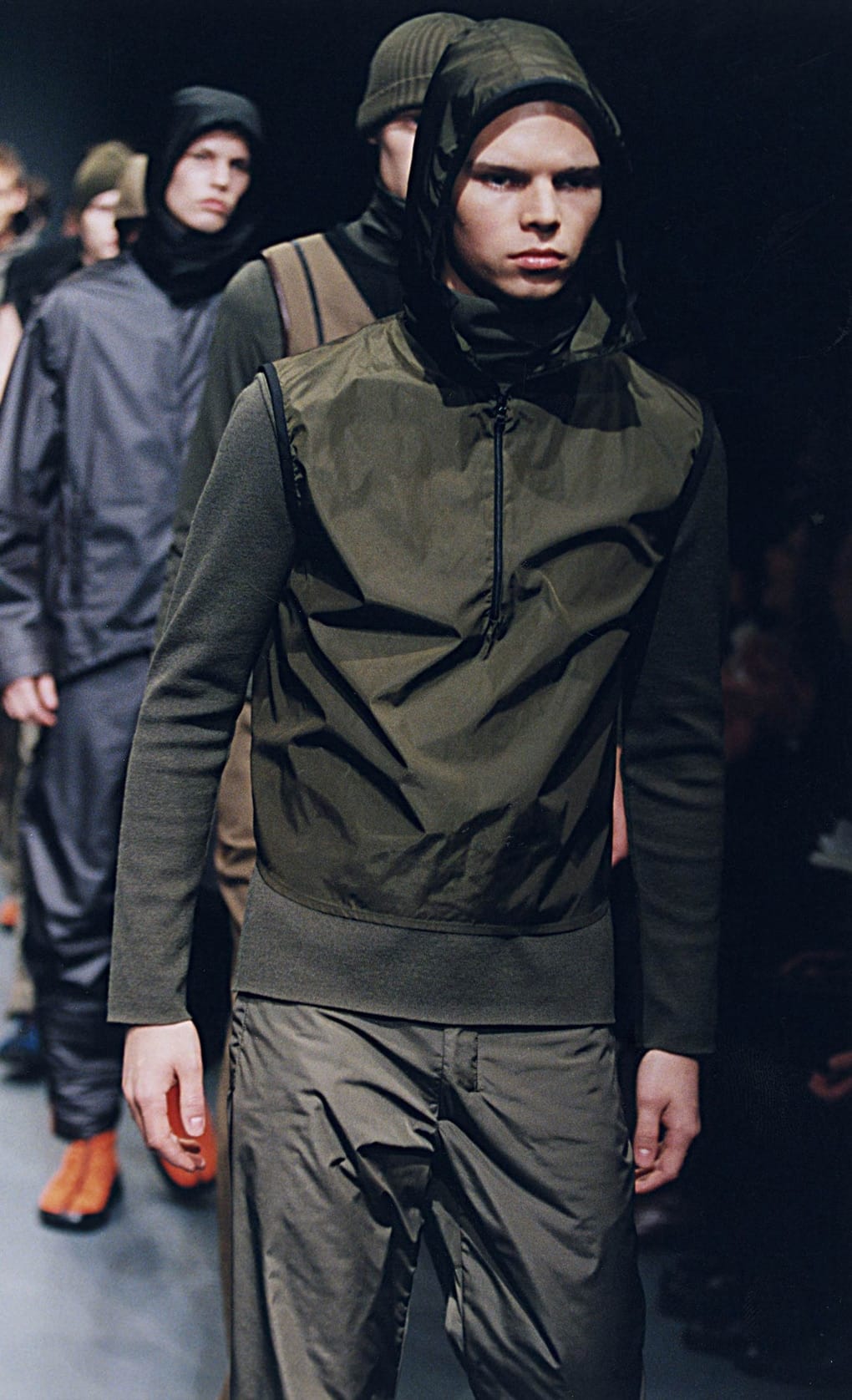Prada Fall/Winter 1999 menswear runway look 51: olive hooded technical top and matching trousers.