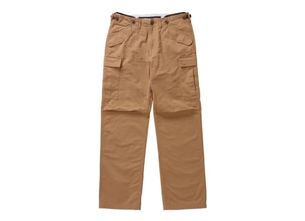 Front view of tan Visvim Eiger Sanction cotton-twill pants with angled pockets and side cargo pockets.