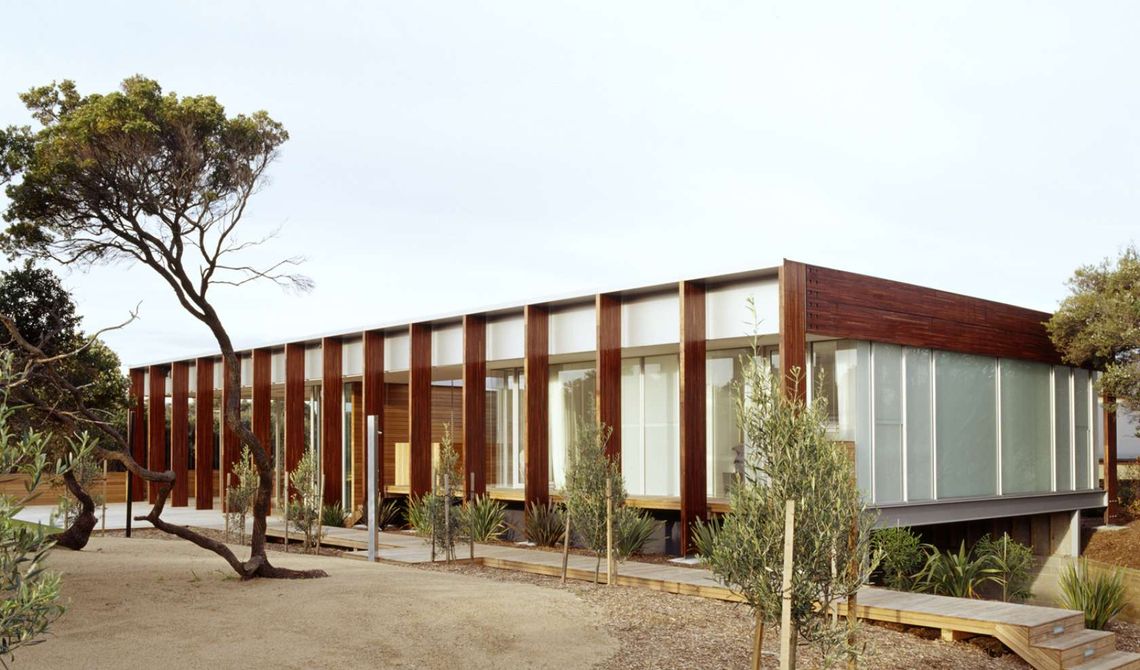 Two Living Pavilions Under One Roof Open Onto an Outdoor Covered Deck