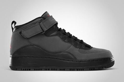 Black tactical high-top sneaker with rugged sole.