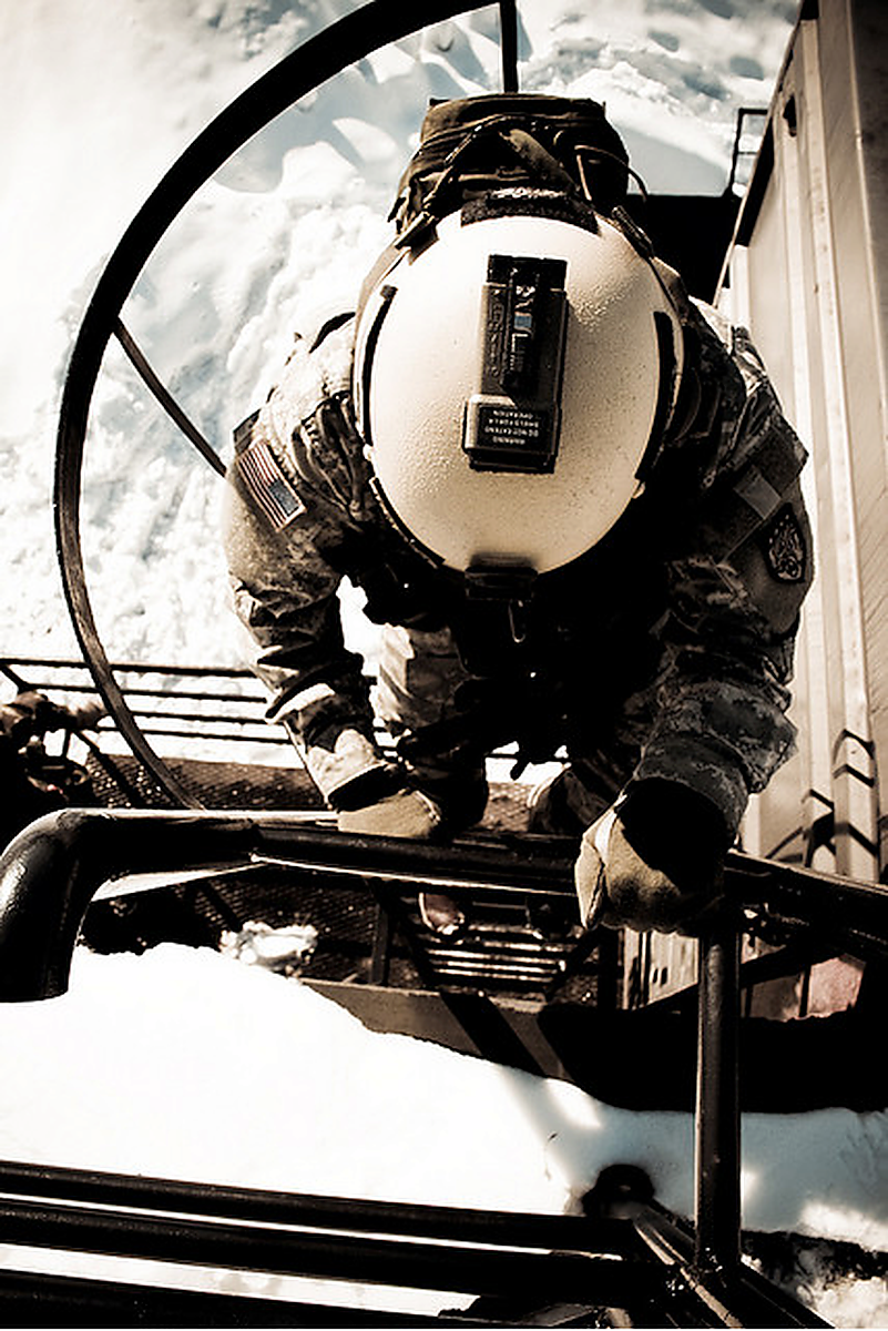Helmet camera snow field kit on a ladder platform.