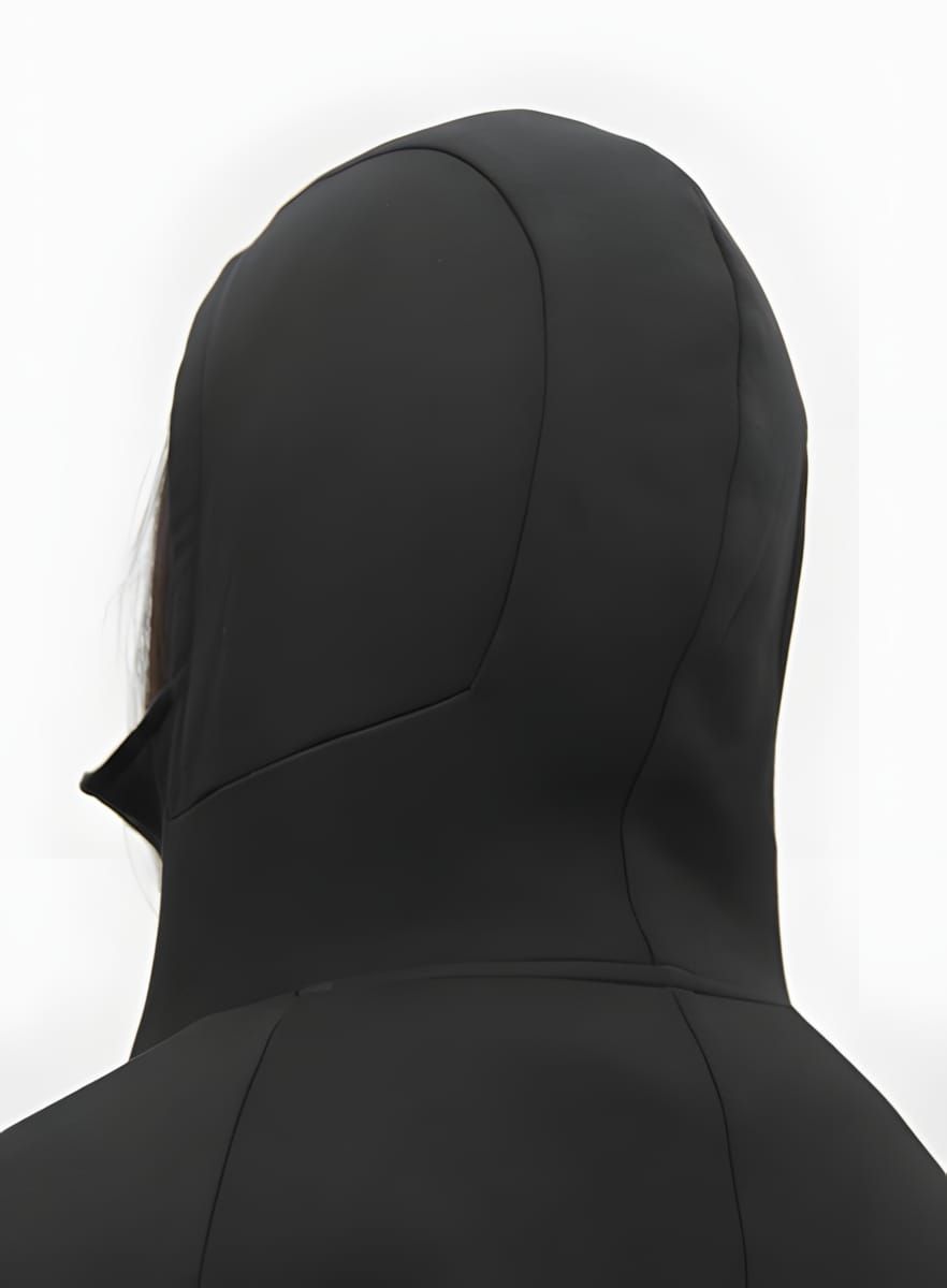 Rear view of a sculpted black Gyakusou articulated hoodie hood, showing precise panel seaming.
