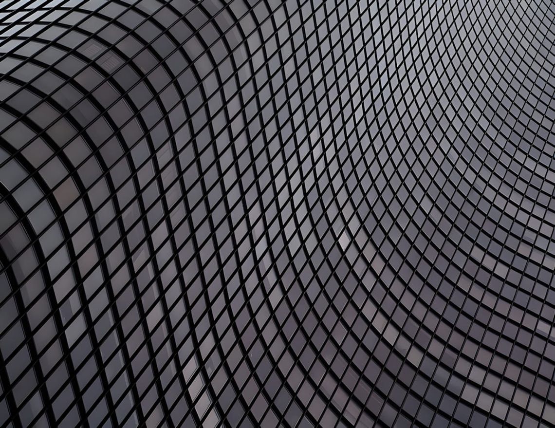Close-up B&W photo of curved stainless steel shingle cladding on the Jay Pritzker Pavilion, Chicago