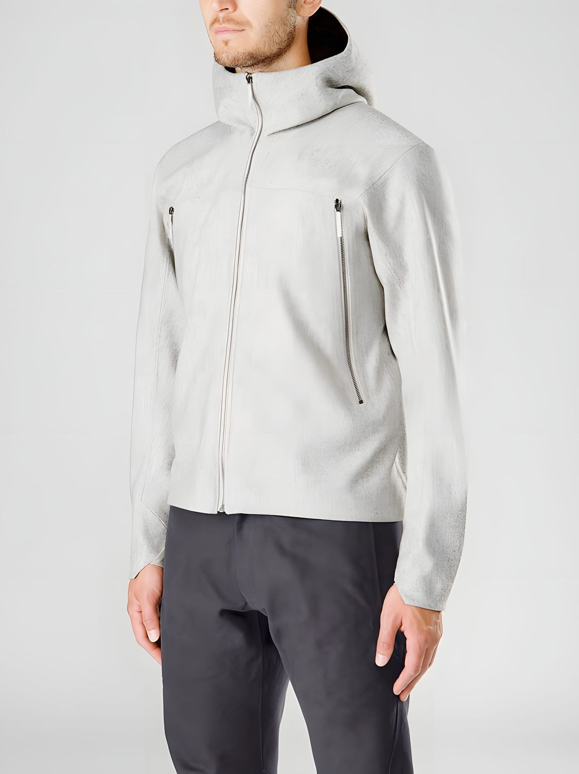 Arc'teryx Veilance Field Jacket in heather grey, worn on a male model against a light grey background. Full-zip hooded silhou