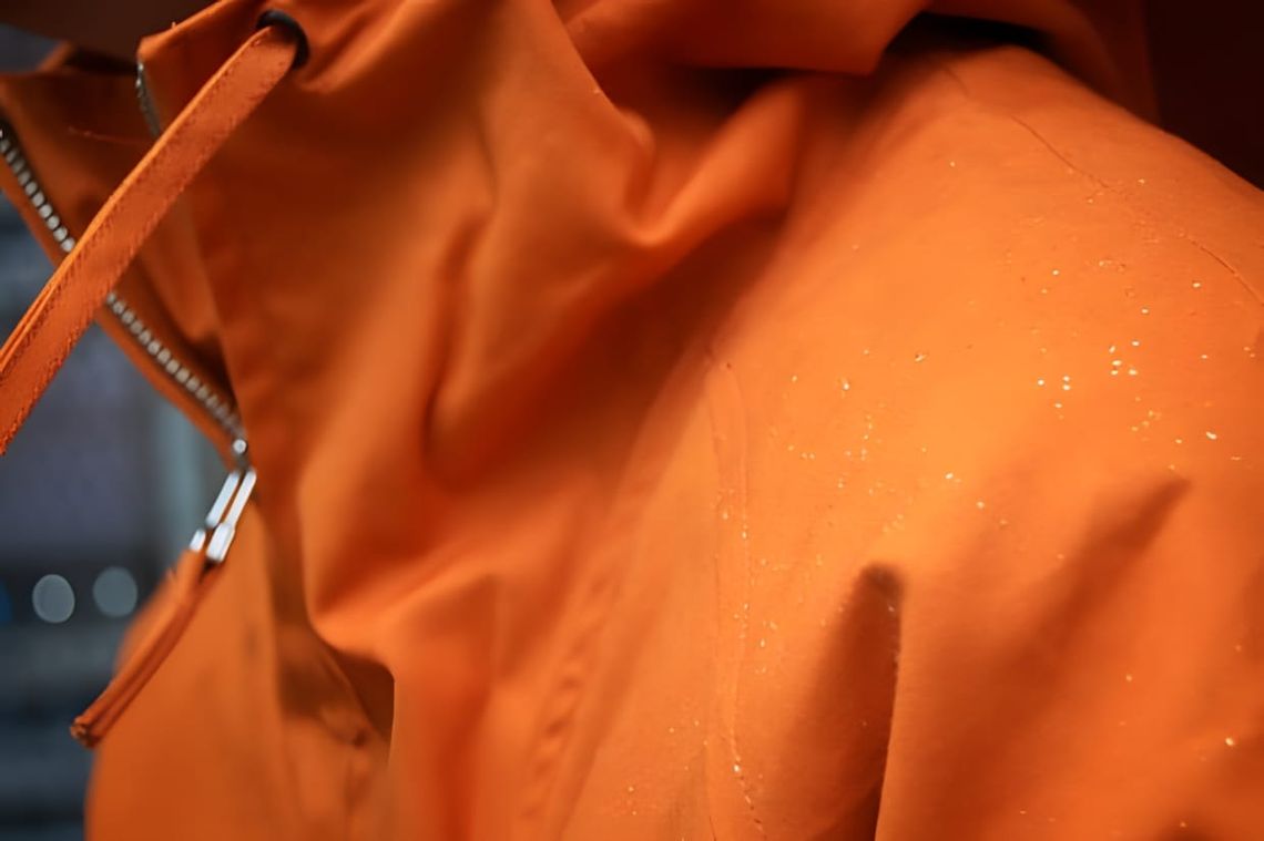 Oi Polloi x Norse Projects Kaare Smock Jacket in orange ripstop pullover anorak construction