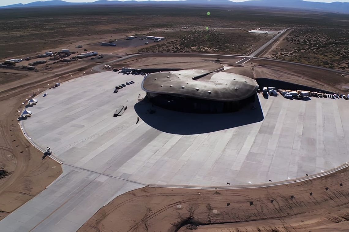 Aerial view of Spaceport America terminal, earth-sheltered elliptical concrete roof on Chihuahuan Desert hardstand, NM, 2011.