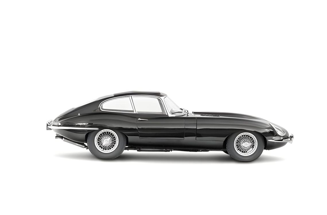 Black Jaguar E-Type Series 1 Fixed Head Coupe, side profile on white background, wire spoke wheels.