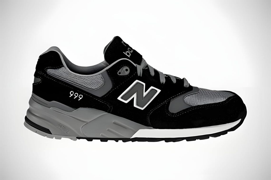 New Balance ML999 lateral view, black suede and grey mesh upper, white N logo, grey midsole, Fall 2011.