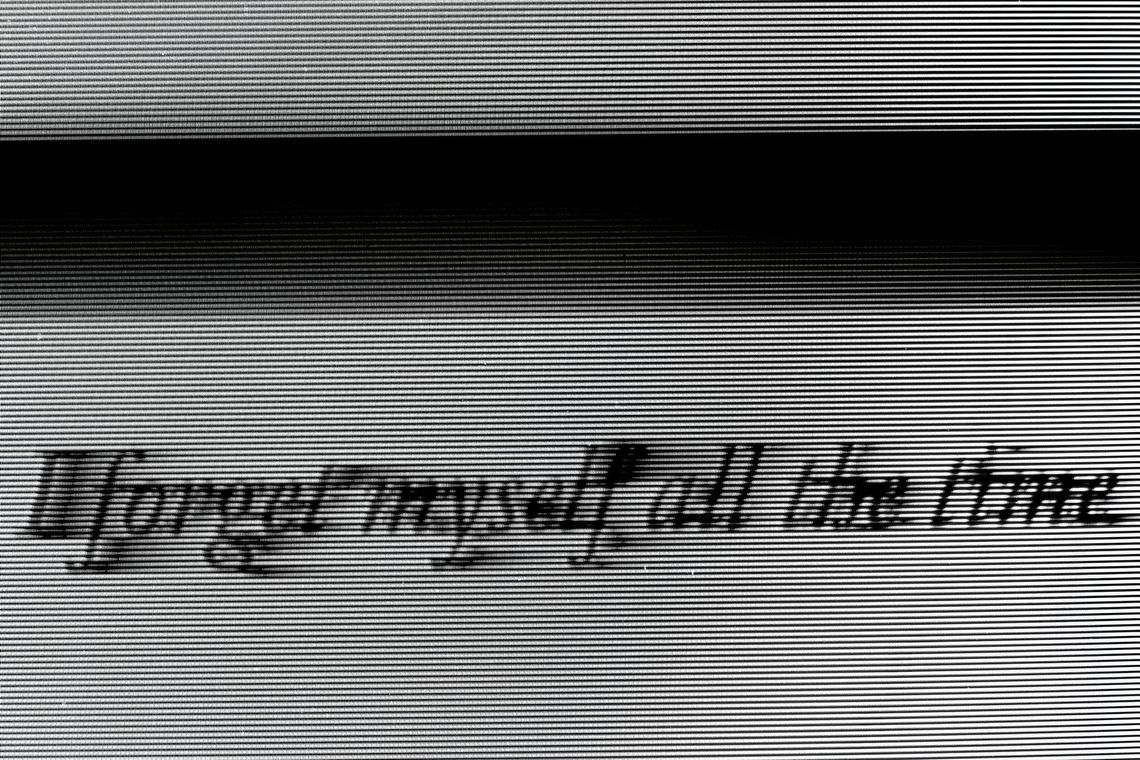 Halftone scan-line image with cursive text reading "I forget myself all the time" by Karborn, Evidence of Time Travel