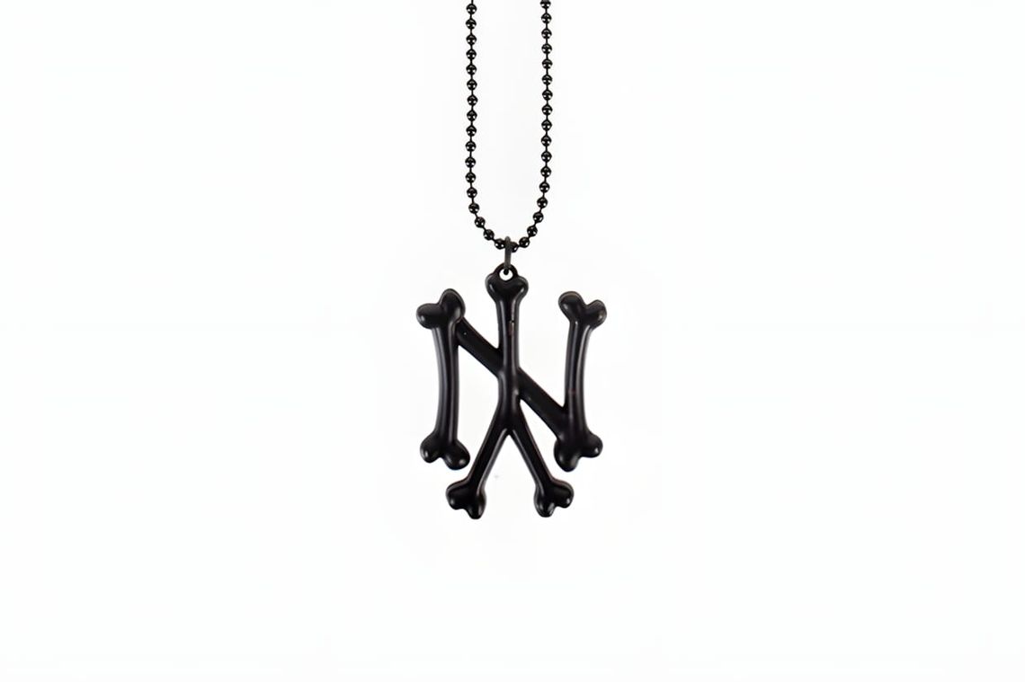 SSUR NY Bones necklace, a jewelry piece featuring the brand's New York bones motif by Ruslan Karablin.
