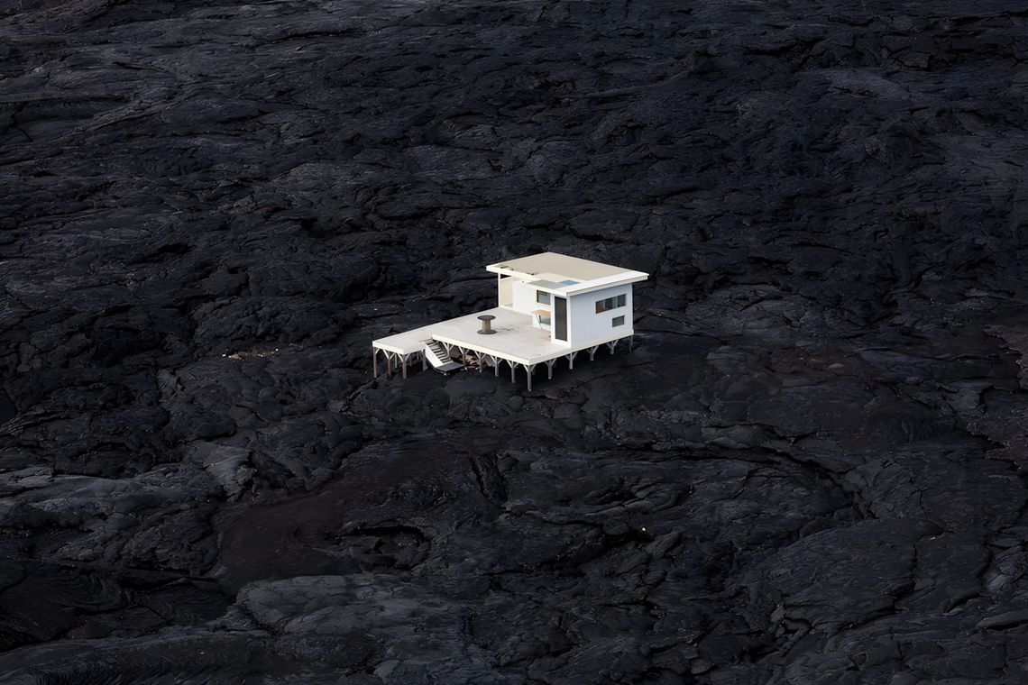 Small modern white house sitting on a black volcanic lava field, Hawaii Big Island, photographed by Michael Wells for his Sco