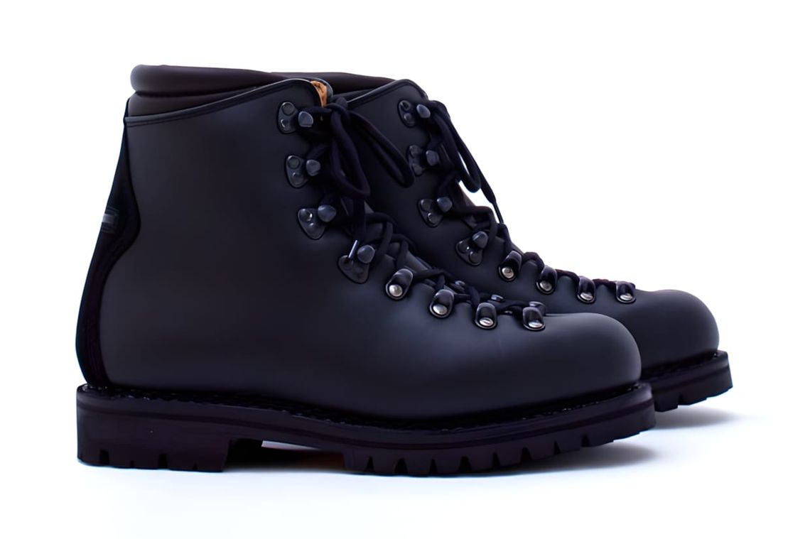 Black full-grain leather lace-up hiking boot by Adam Kimmel, with Vibram outsole and black lace hooks, made in Italy.