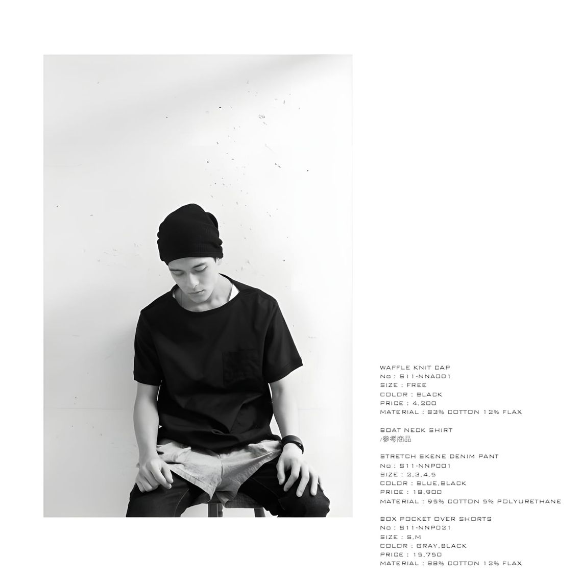 Male model in black waffle knit cap and black boat neck shirt, seated, from nonnative Spring/Summer 2011 lookbook with produc