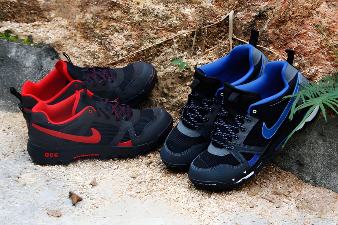 Nike ACG Rongbuk Mid Gore-Tex boots in two colorways: black/red (left) and black/royal blue (right).
