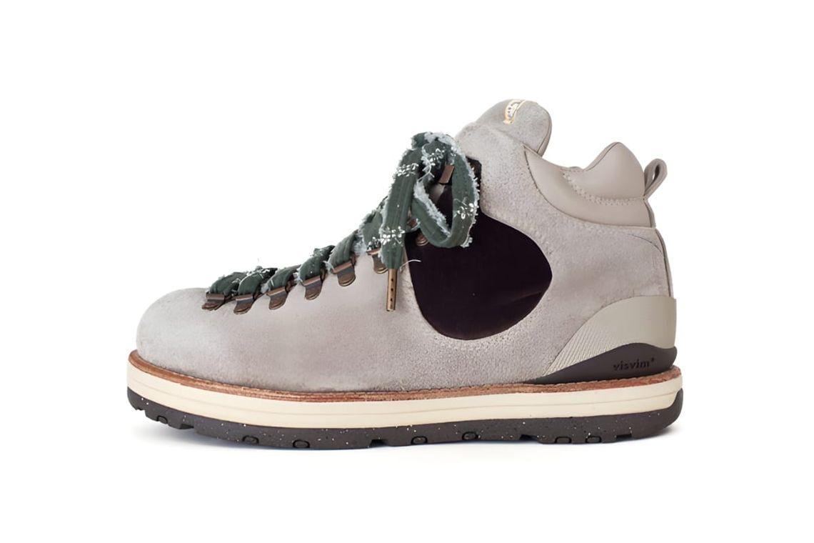 Visvim Serra Pizi Boots in natural grey suede — lateral profile view showing PIZI woven forest-green braided laces, dark brow