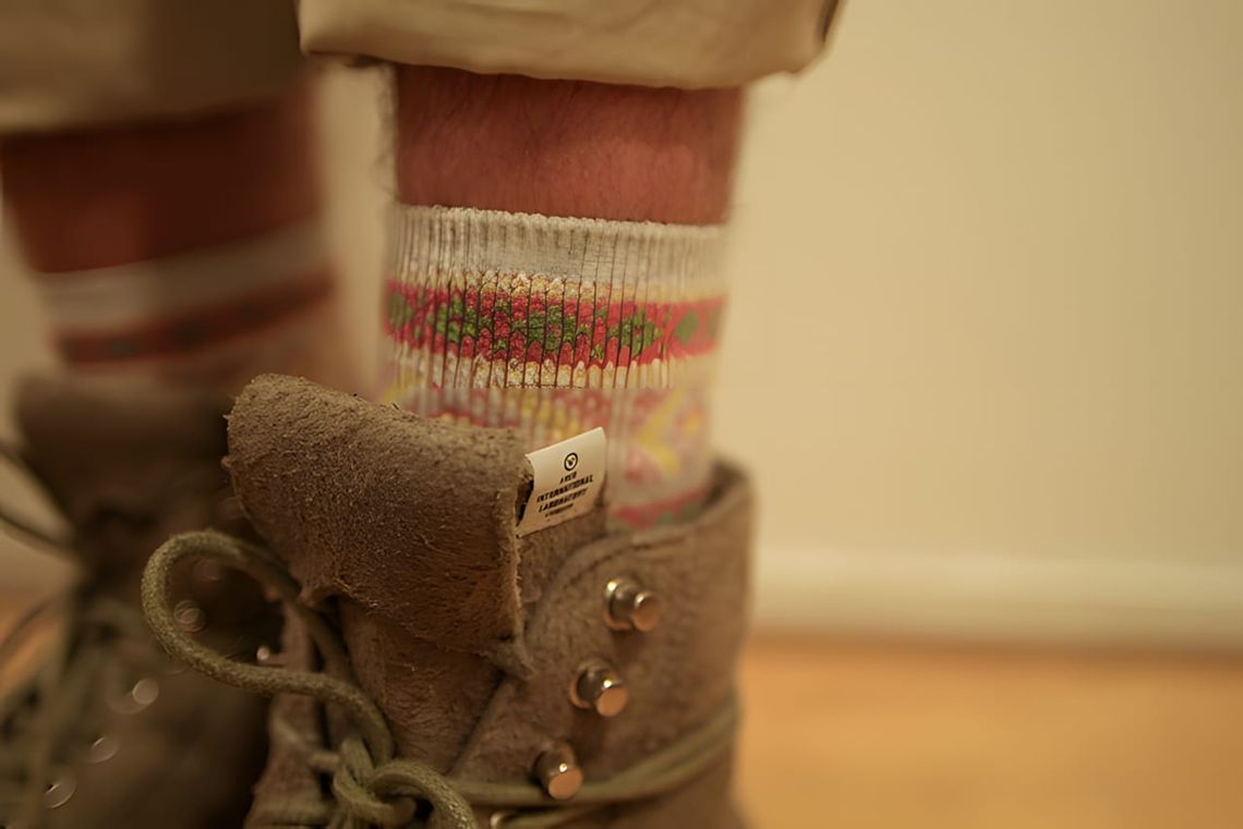 Worn-on-feet close-up of L.L. Bean East Point hiking boots in brown suede/nubuck with silver D-ring eyelets and fold-over ton