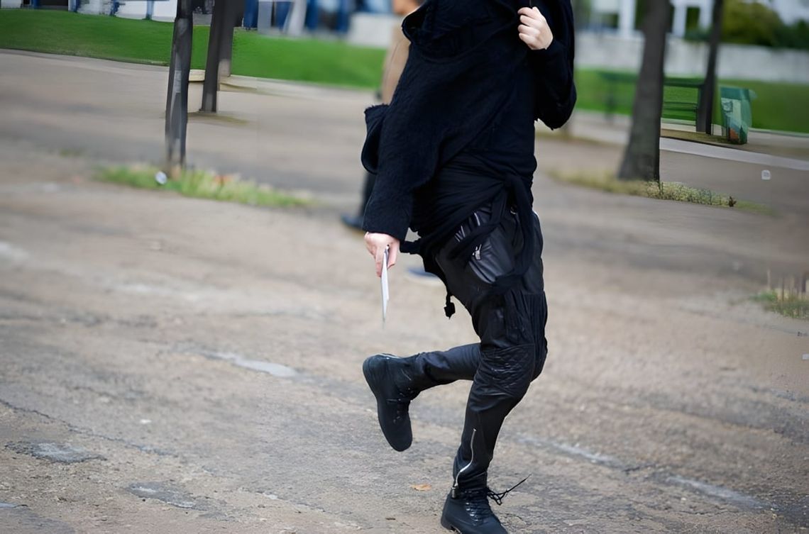Julius black coated gasmask cargo pants, Fall/Winter 2012 Resonance collection — dropped crotch silhouette with wrapped leg s