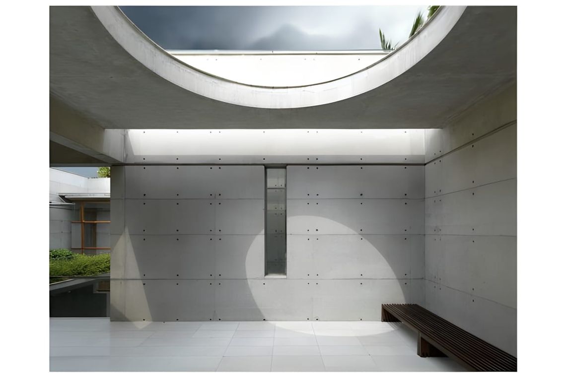 Exterior view of the S.A. Residence in Dhaka, Bangladesh — a concrete house with water courtyards designed by SHATOTTO archit