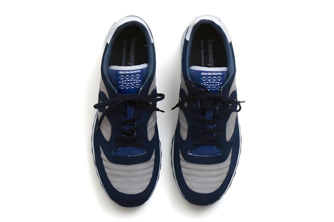 White Mountaineering x Saucony Jazz Original sneaker in vegetable-dyed calf suede, showing the dual-branded tongue and quilte