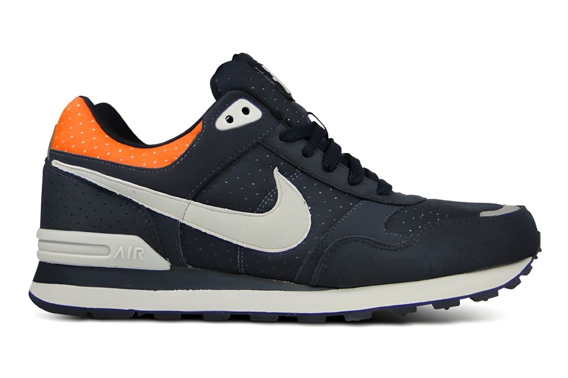 Lateral profile of the Nike Sportswear MS78 LE in Dark Obsidian colorway — perforated navy leather upper, large grey Swoosh, 