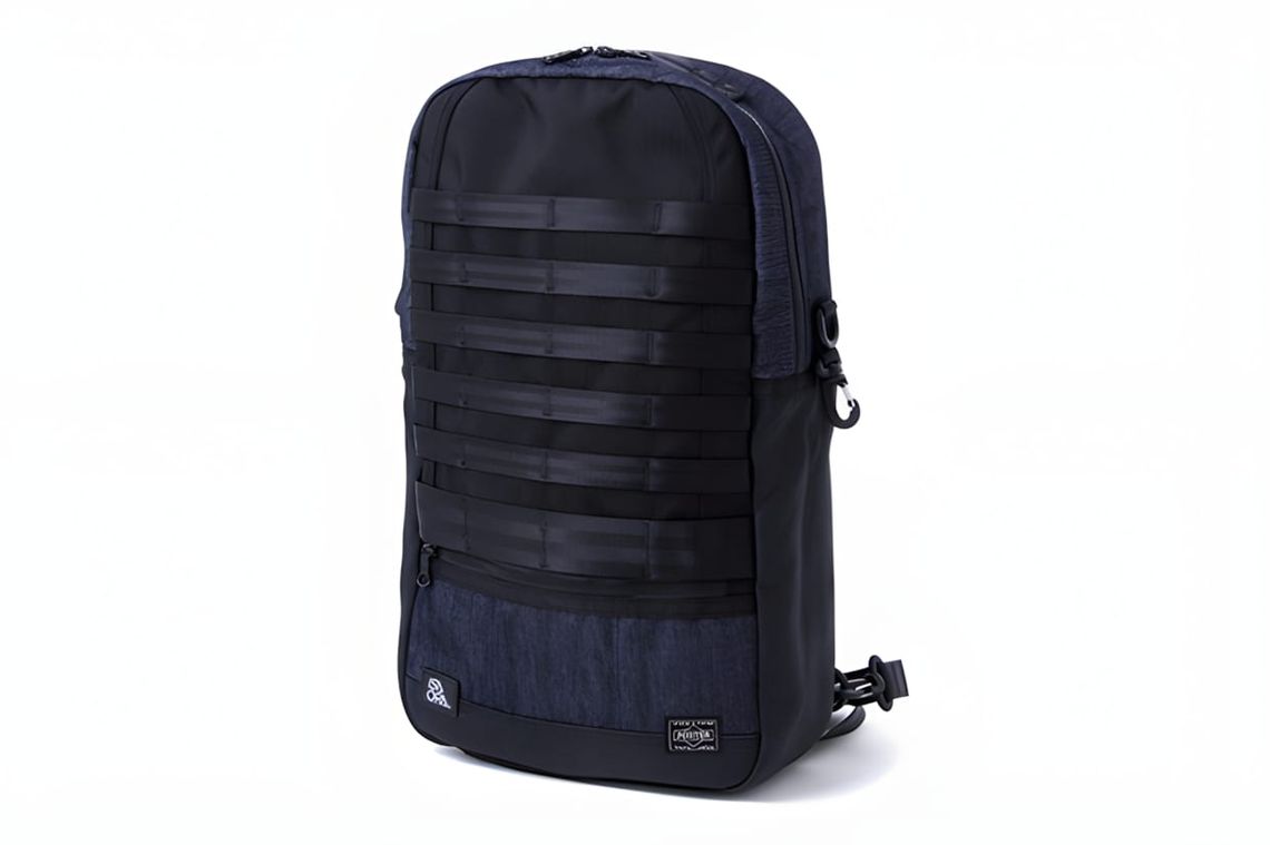 ISAORA x Porter Spring/Summer 2011 25L backpack in navy with black MOLLE webbing rows, front zip pocket, side-release buckles