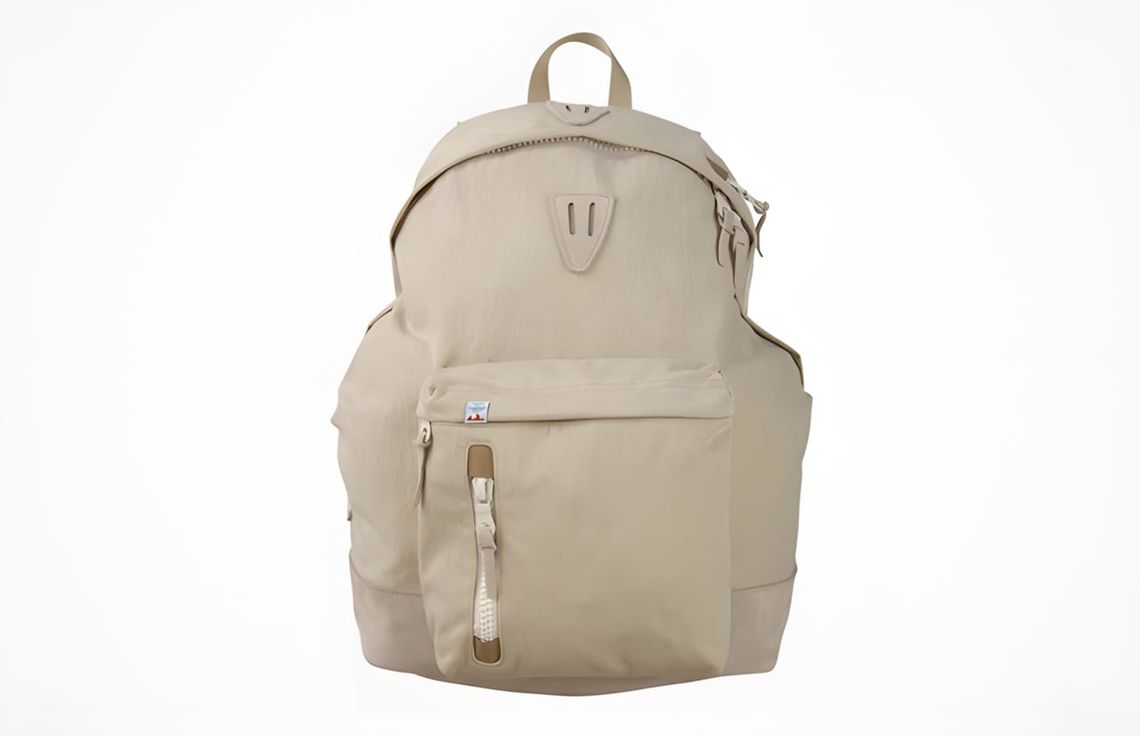 Visvim LAMINA Rucksack 22L KUDU in ecru/natural Konbu baked nylon with Kudu leather zipper pulls and teal brand label, front-